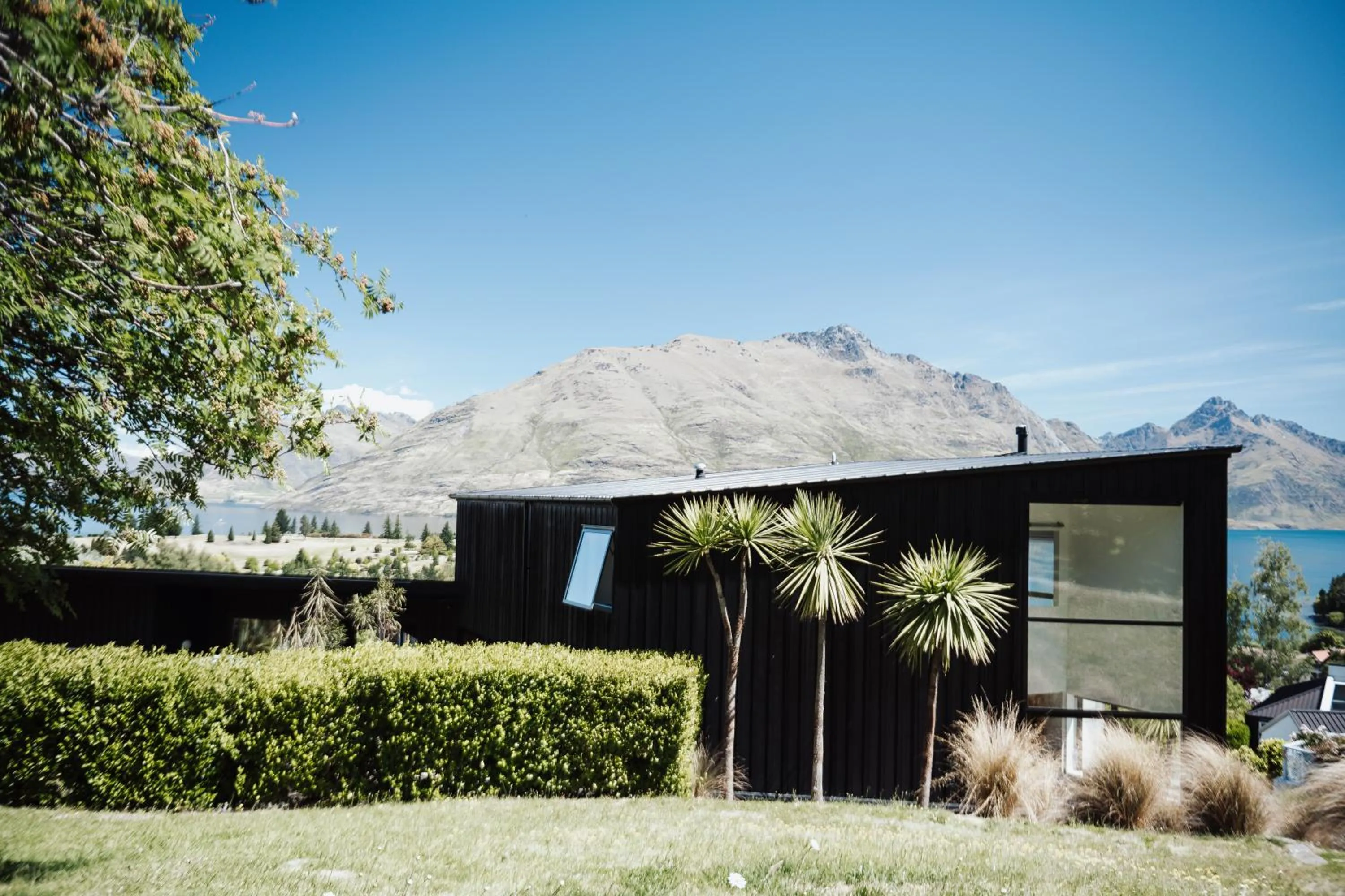 Property building in Award-Winning Modern Retreat with Hot Tub & Views