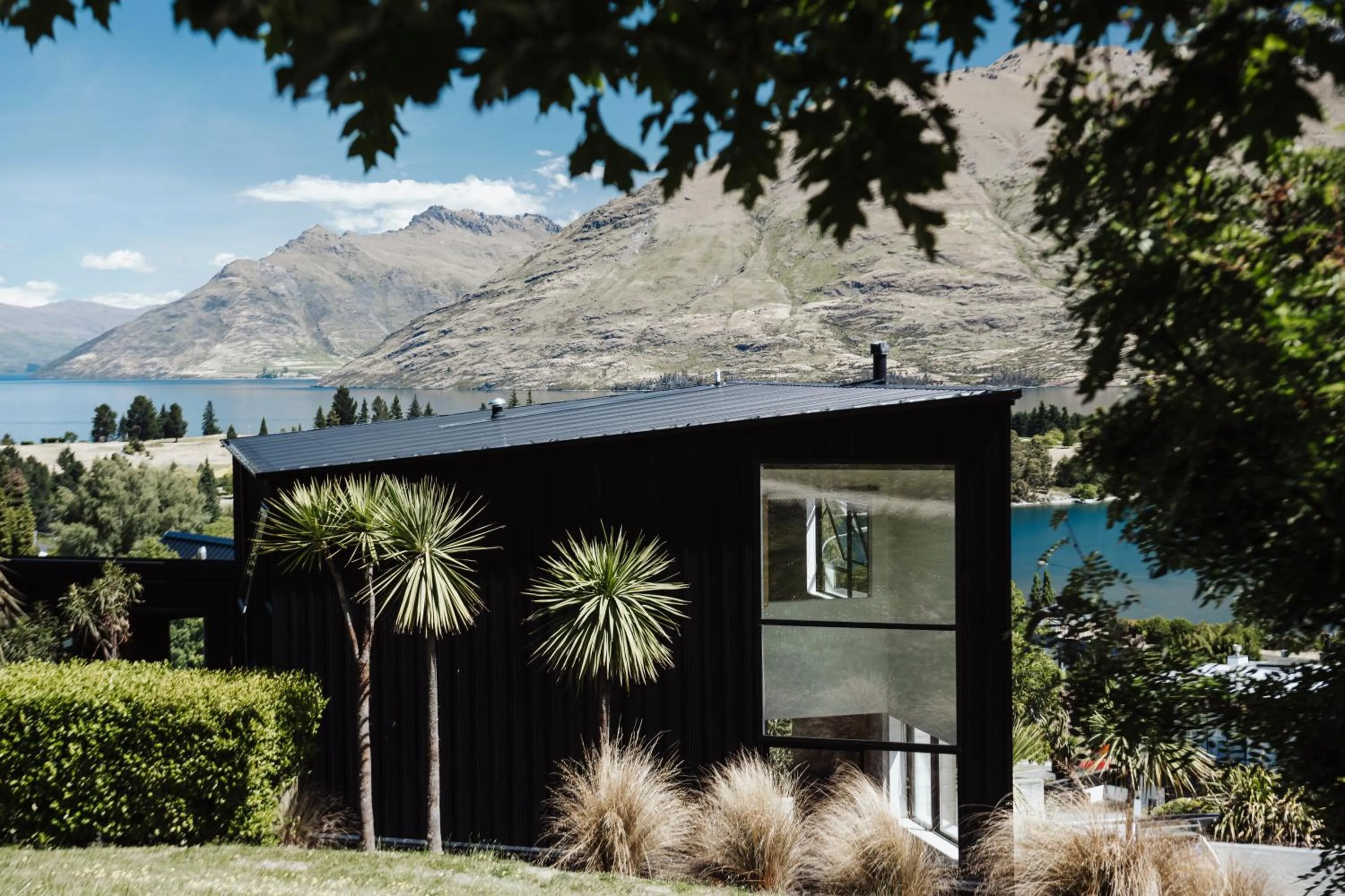Property building in Award-Winning Modern Retreat with Hot Tub & Views