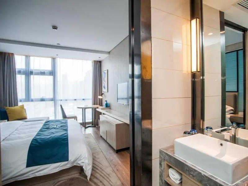 Bed in GreenTree EasternLianyungang Wanda Plaza Hotel