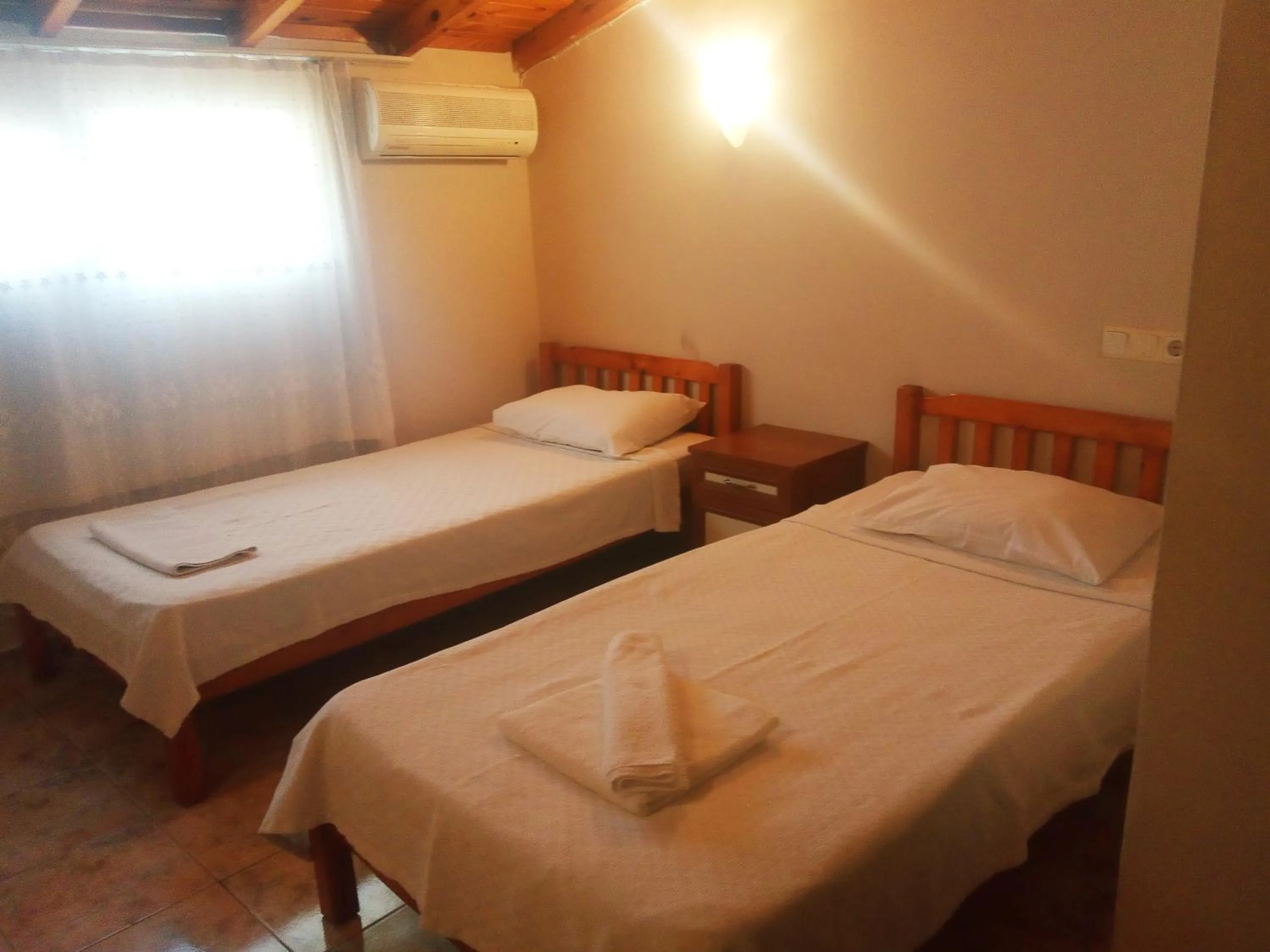 Bed in Dove Apart Hotel