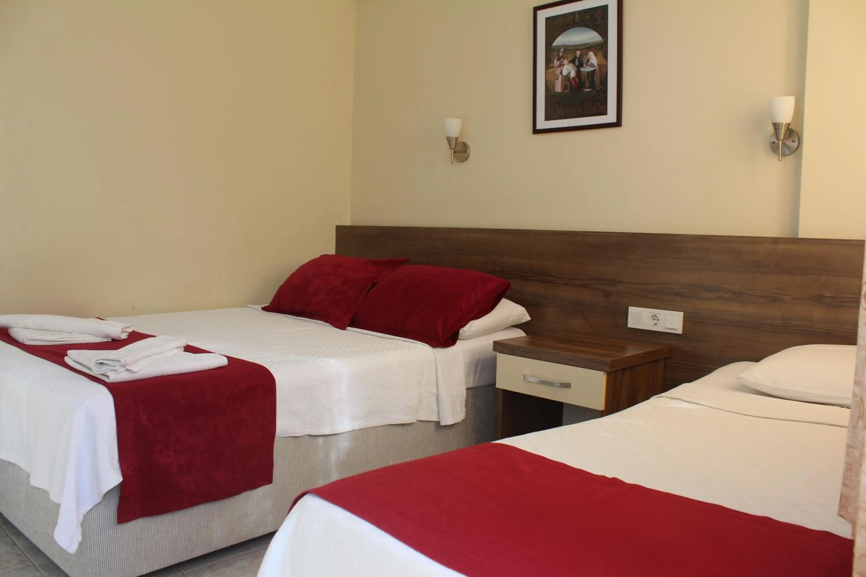 Bed in Dove Apart Hotel