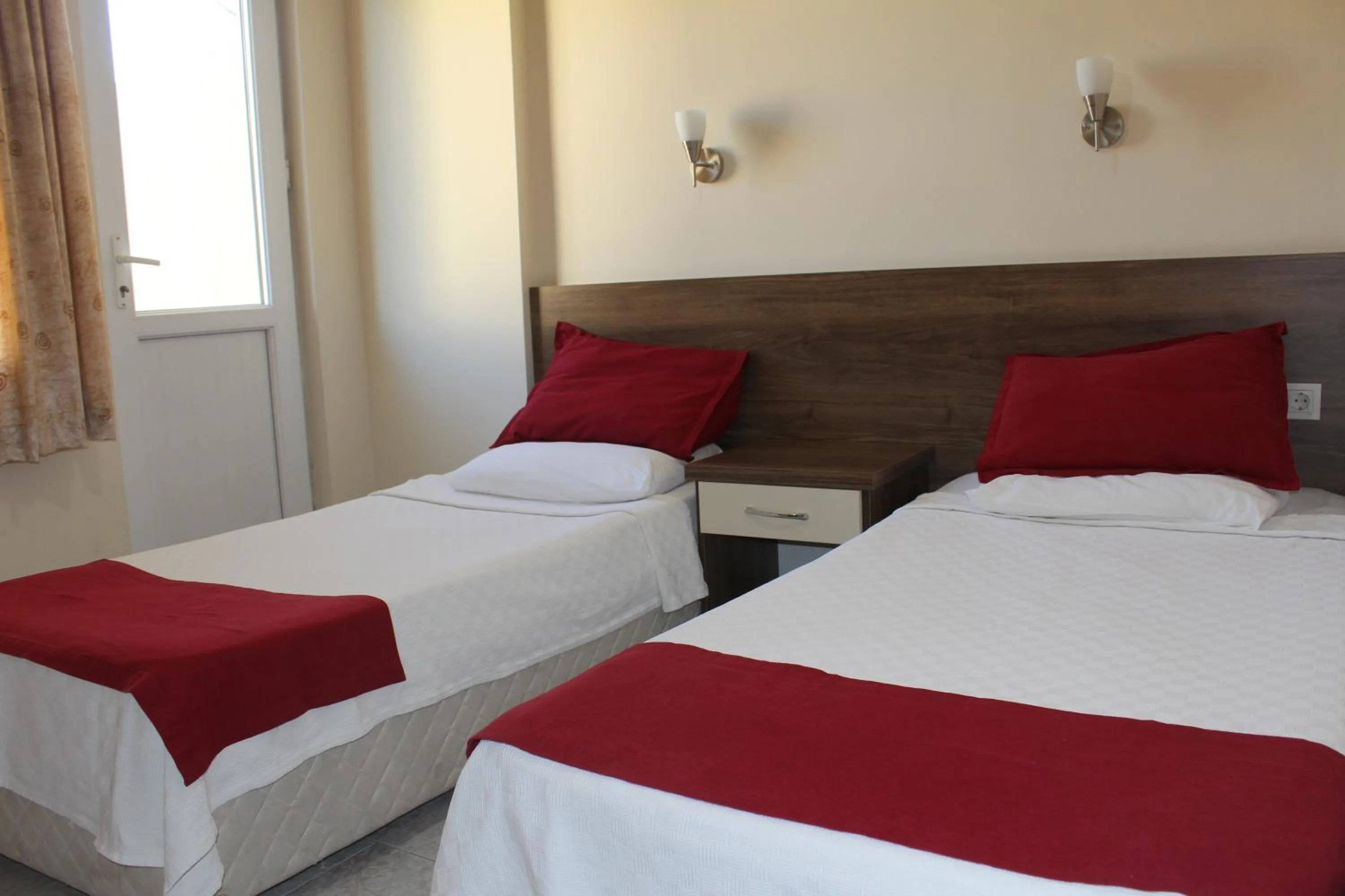 Bed in Dove Apart Hotel