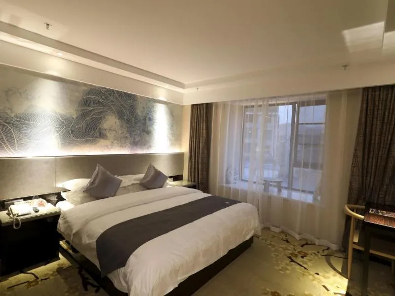 Bed in GreenTree Eastern Jingde Town Railway Station Hotel