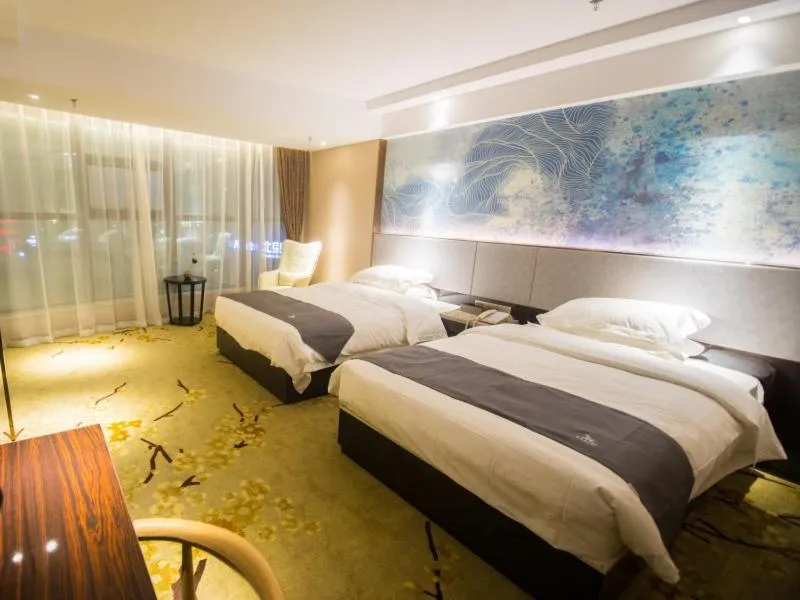 Bed in GreenTree Eastern Jingde Town Railway Station Hotel