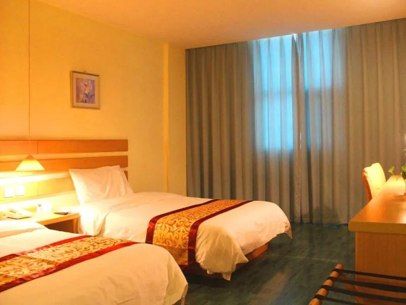 Bed in Shell Xinyu City Railway Station Plaza Hotel