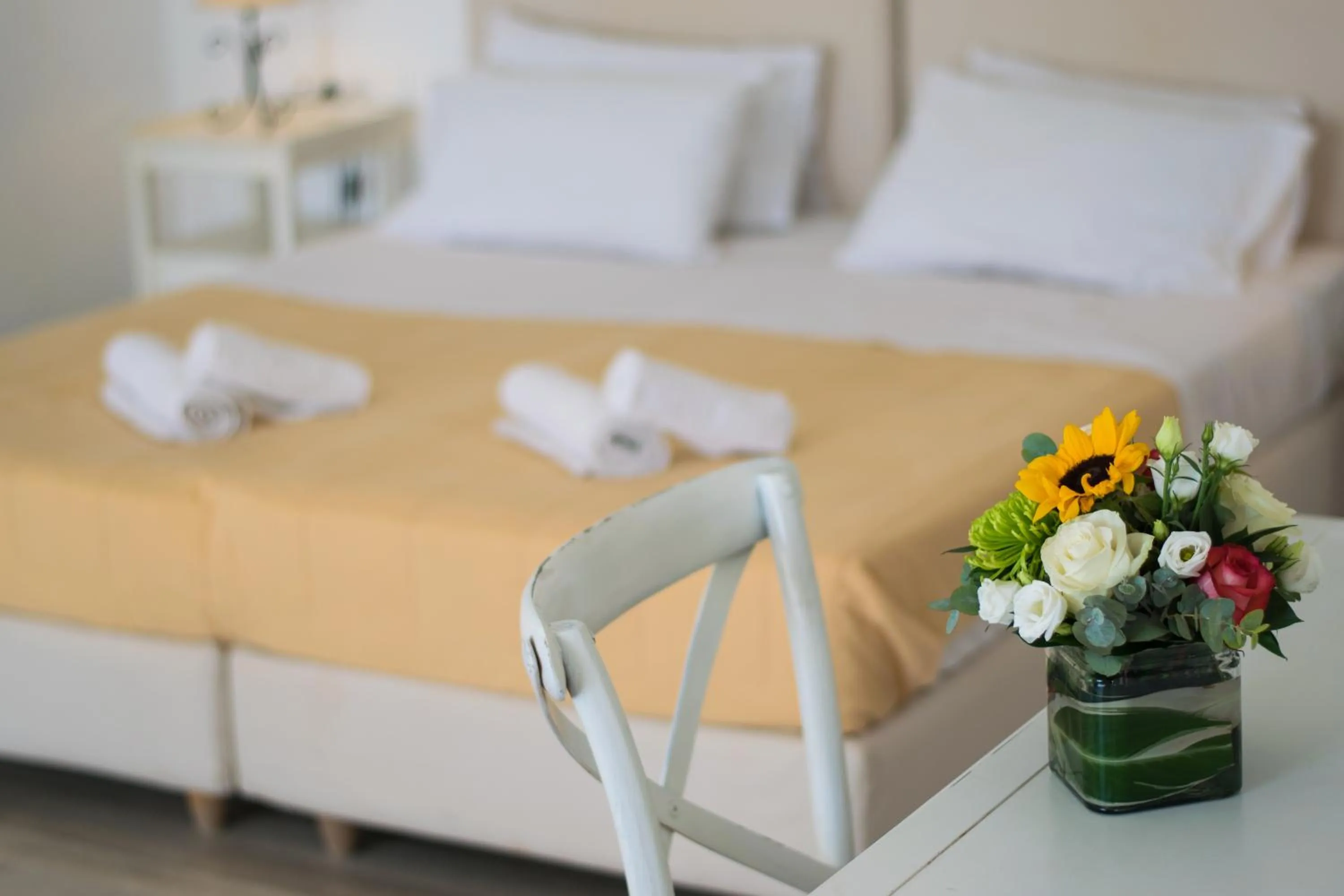 Bed in With-inn Mykonos Suites
