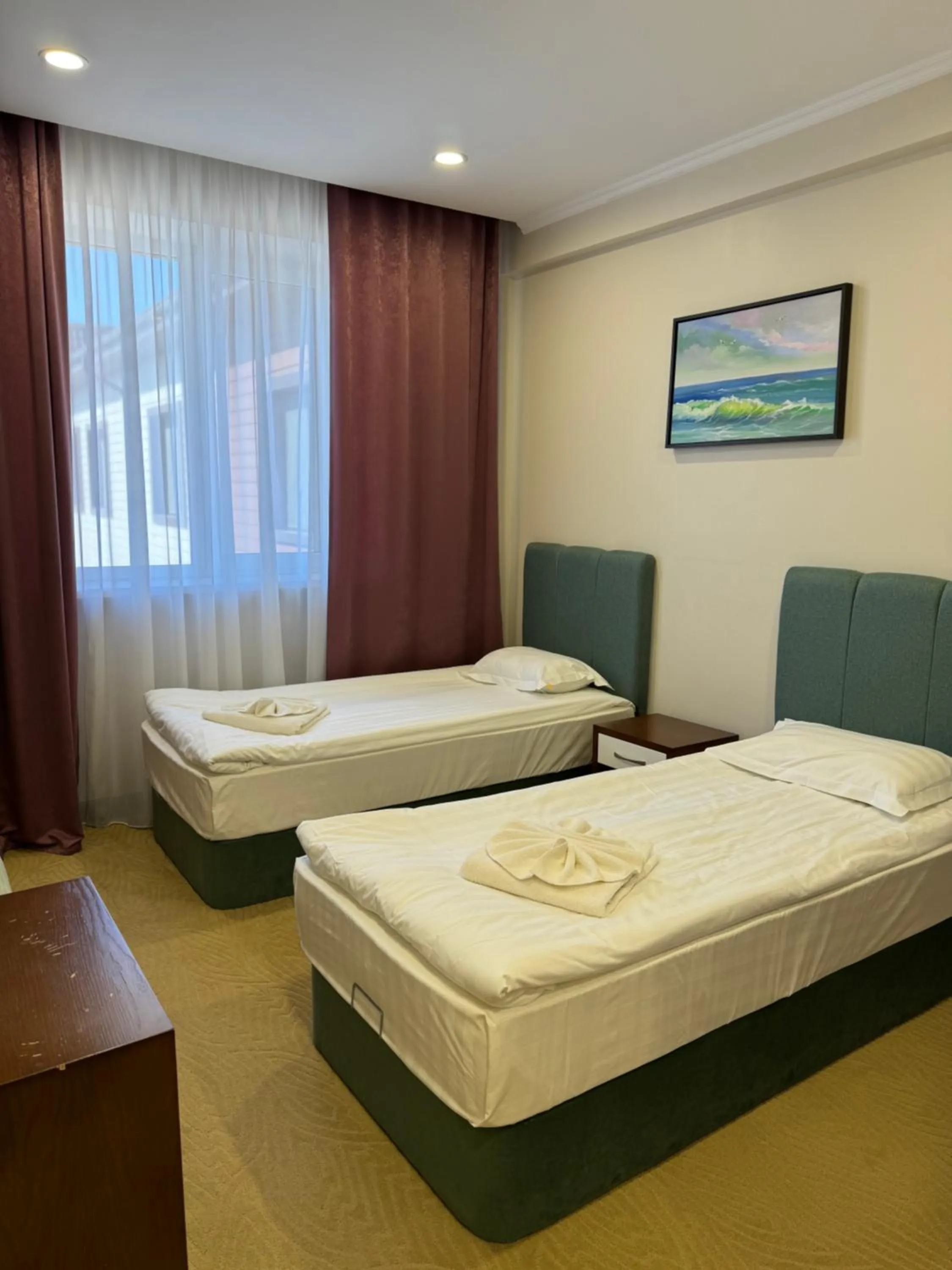 Bed in SULO Atyrau Hotel