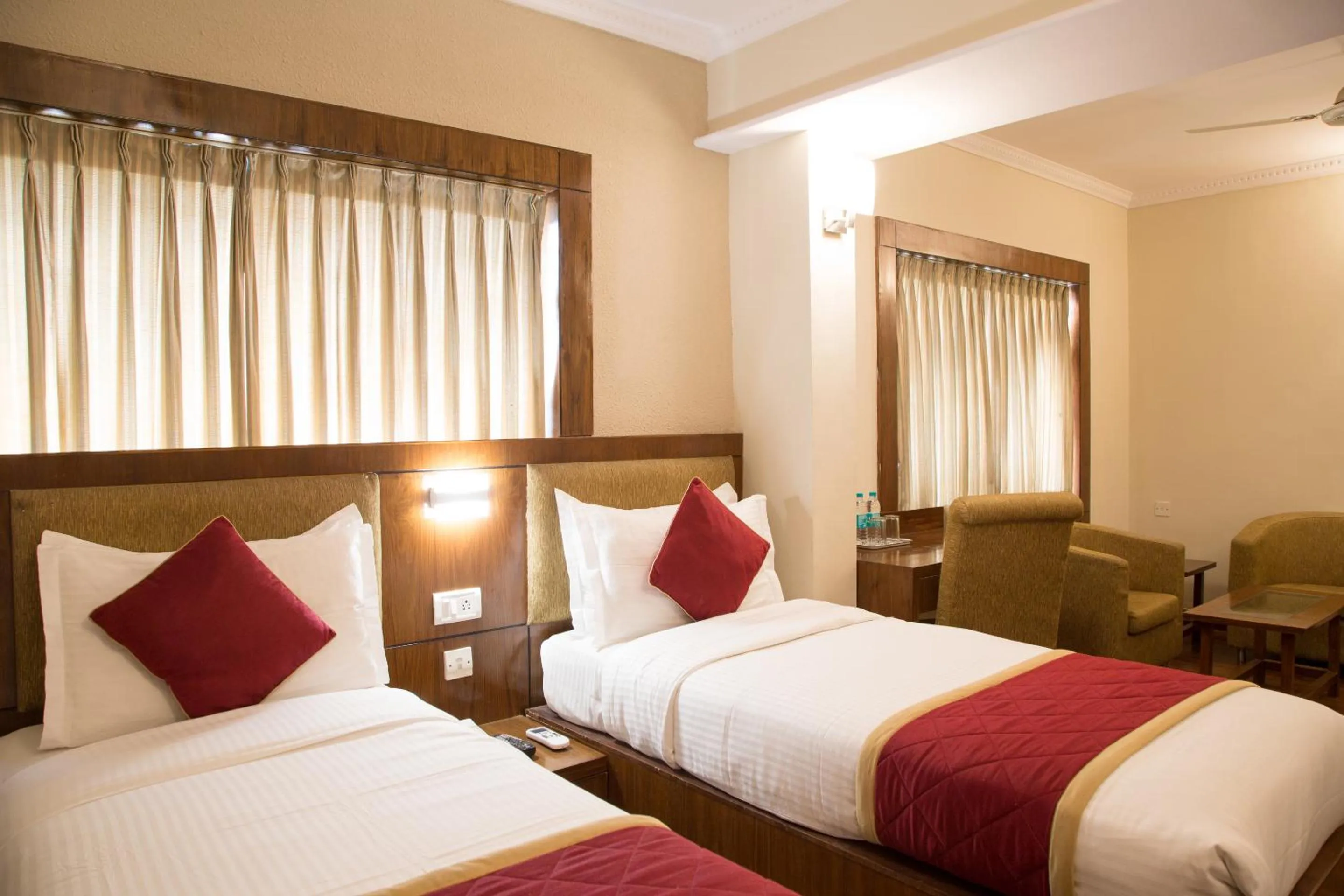 Bed in New Rainbow Business Hotel