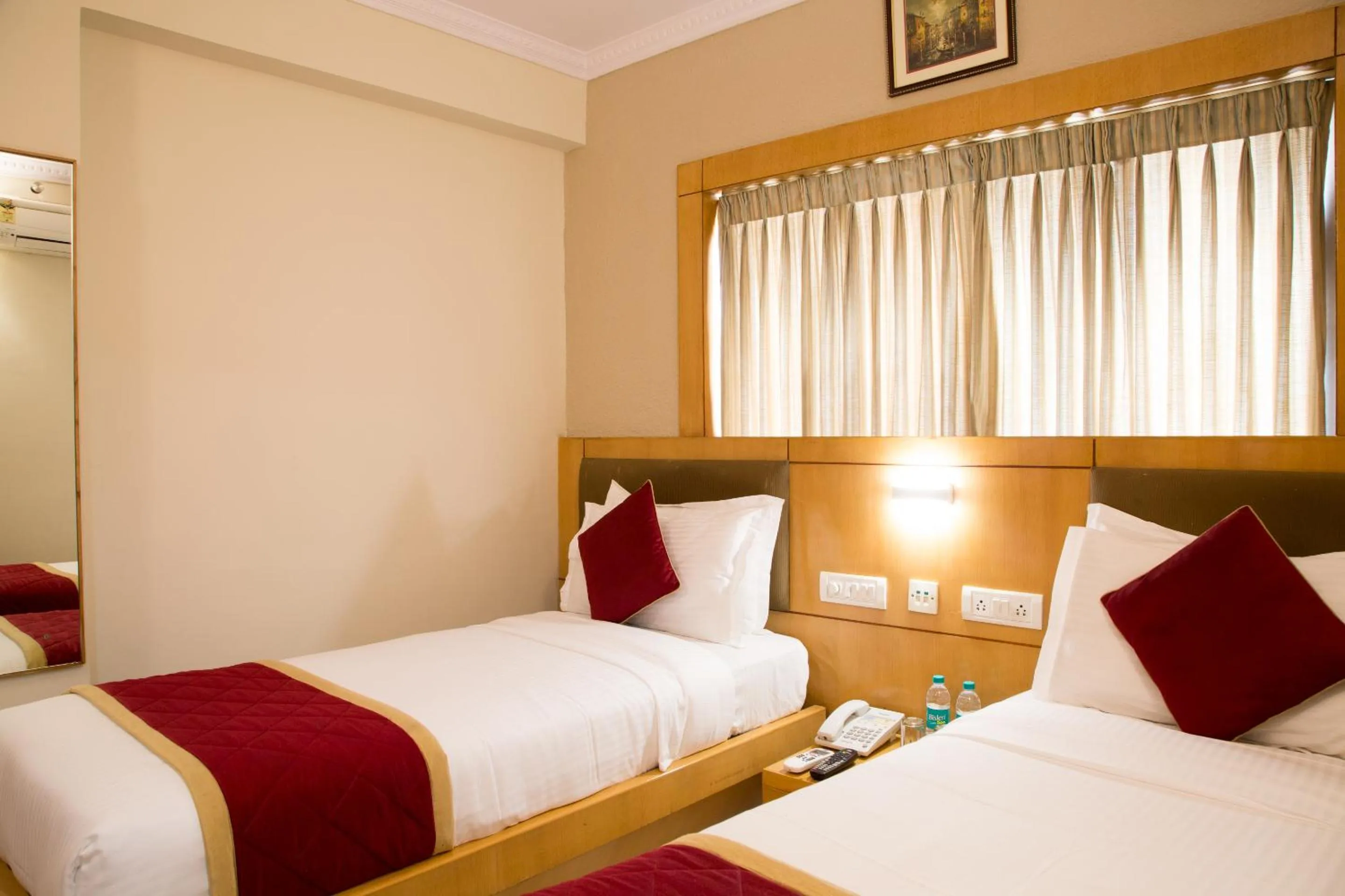 Bed in New Rainbow Business Hotel