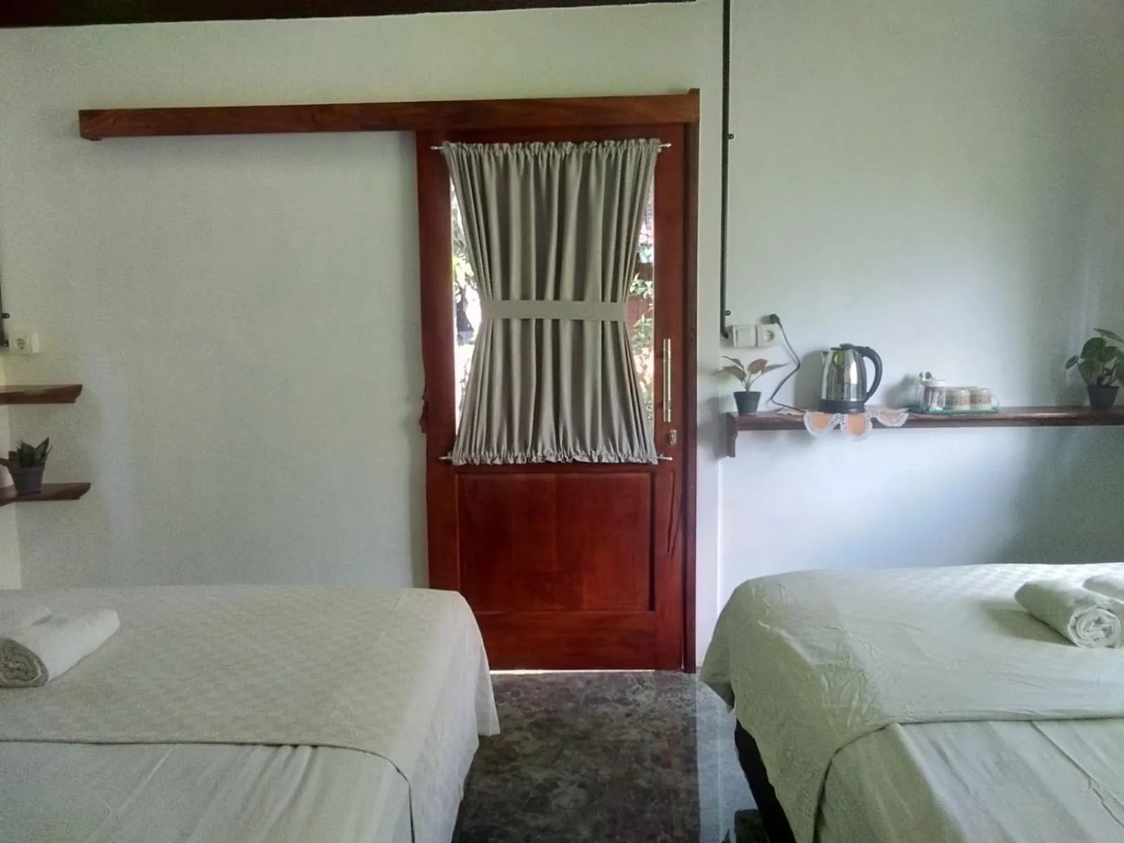 Bed in Mettaloka Guesthouse