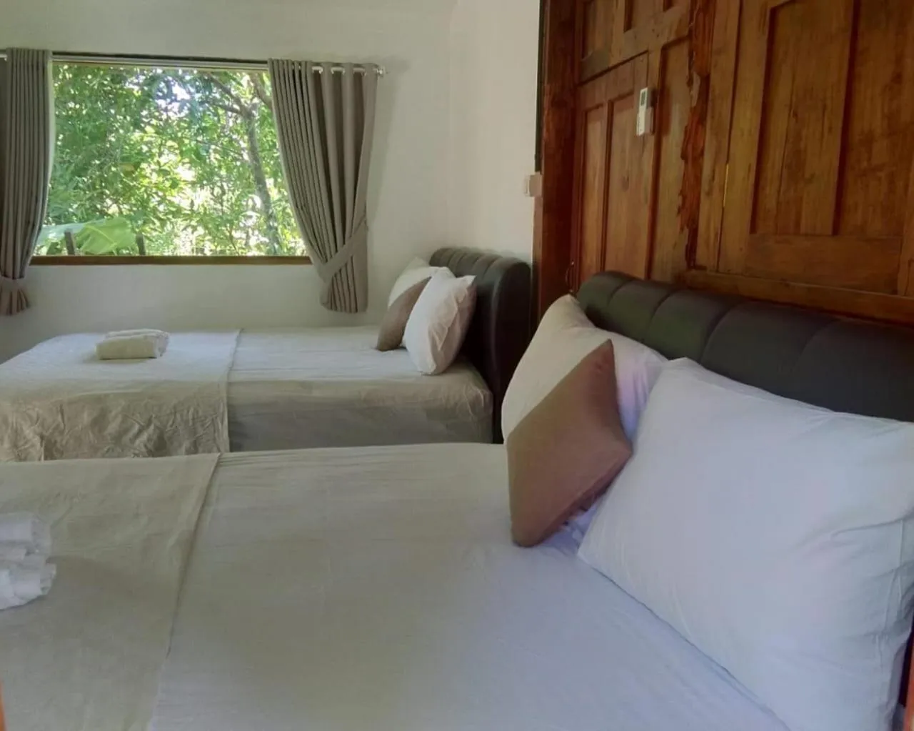 Bed in Mettaloka Guesthouse