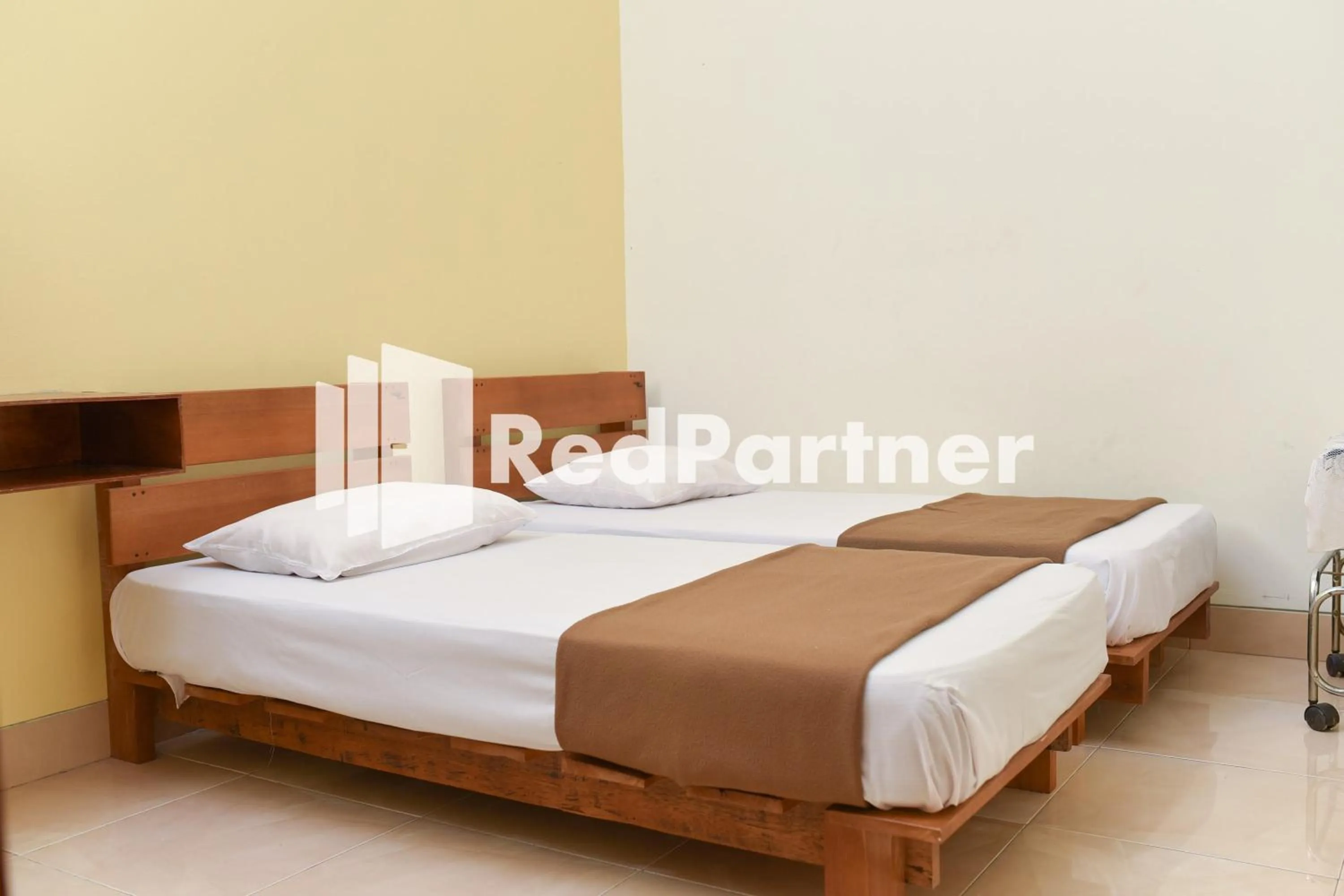 Bed in Homestay Rumah Citra Indah Syariah Mitra RedDoorz