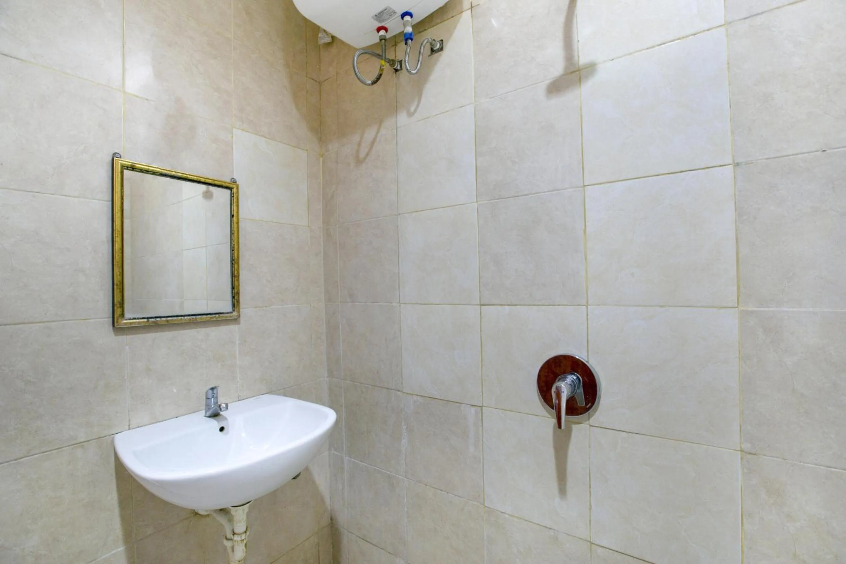 Bathroom in Hotel O Charvita