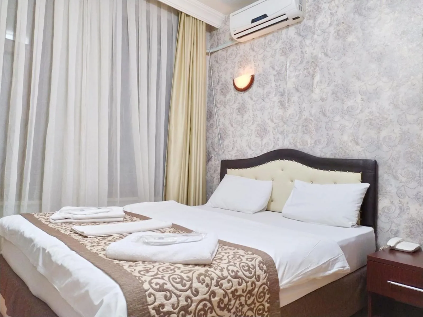 Bed in Taxim Hotel Marin