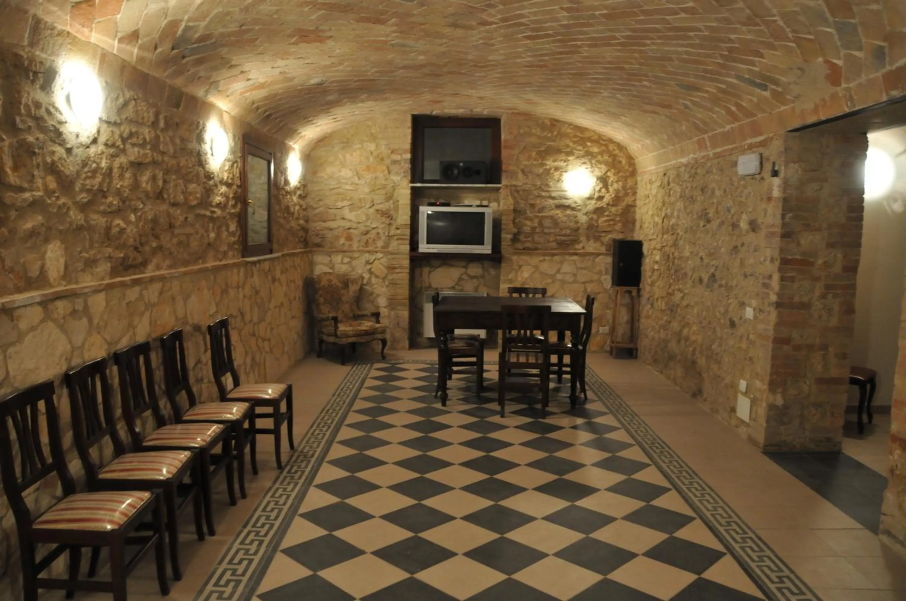 Communal lounge/ TV room in Villa Regina