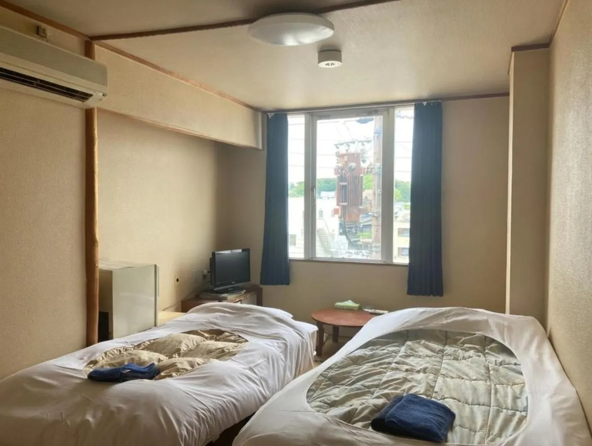 Bed in Tabist Chunichi Business Hotel Shima