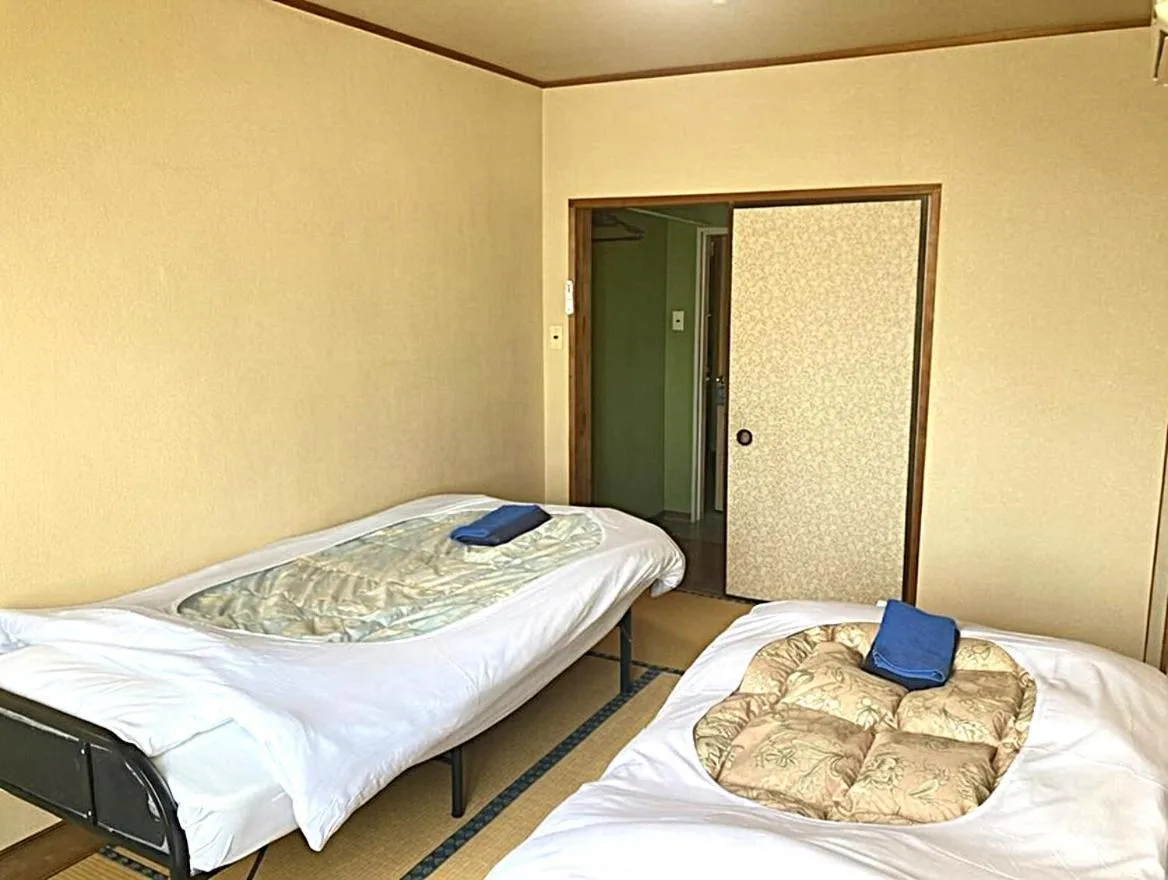 Bed in Tabist Chunichi Business Hotel Shima