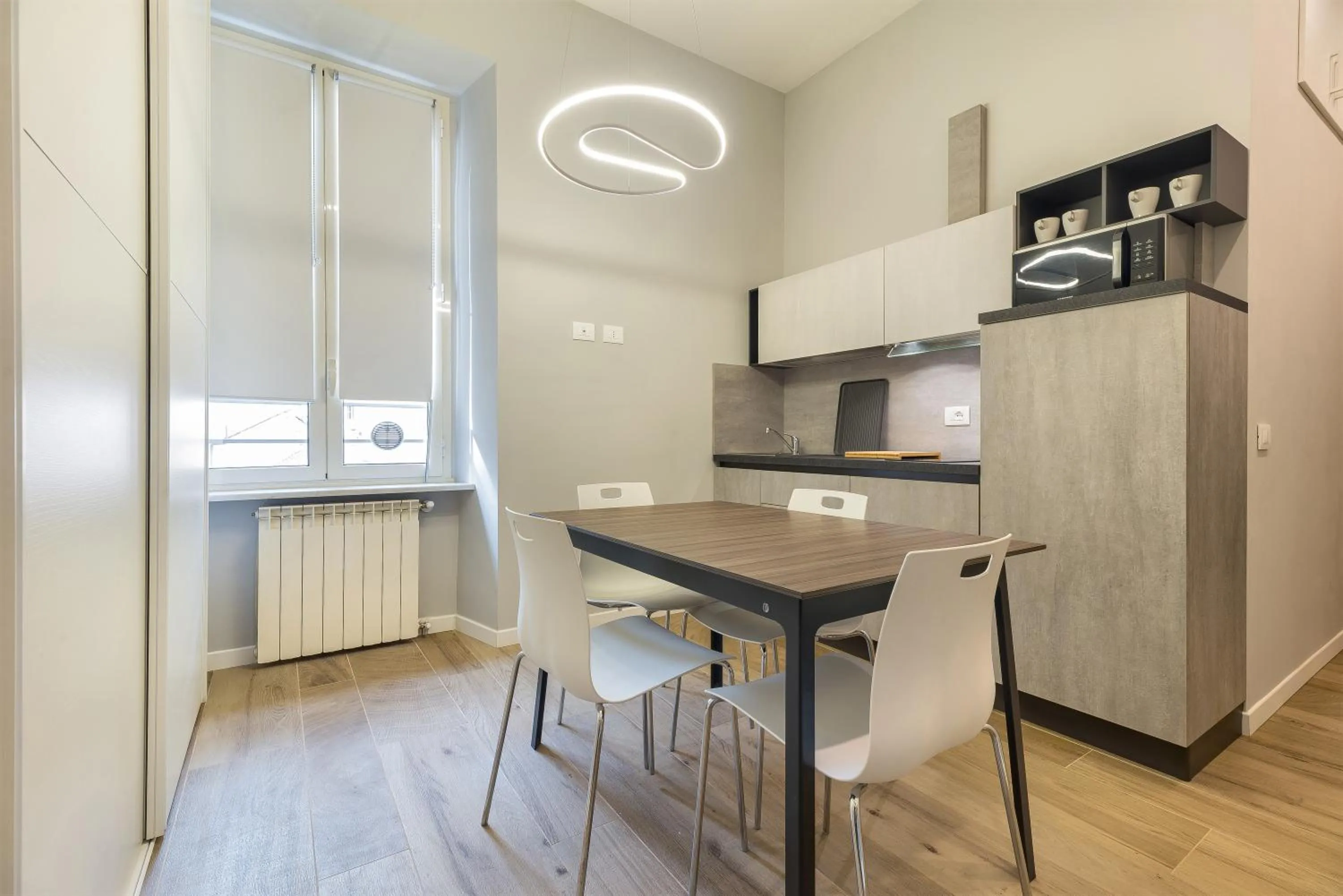 Communal kitchen in B-STAY Via Milano 52