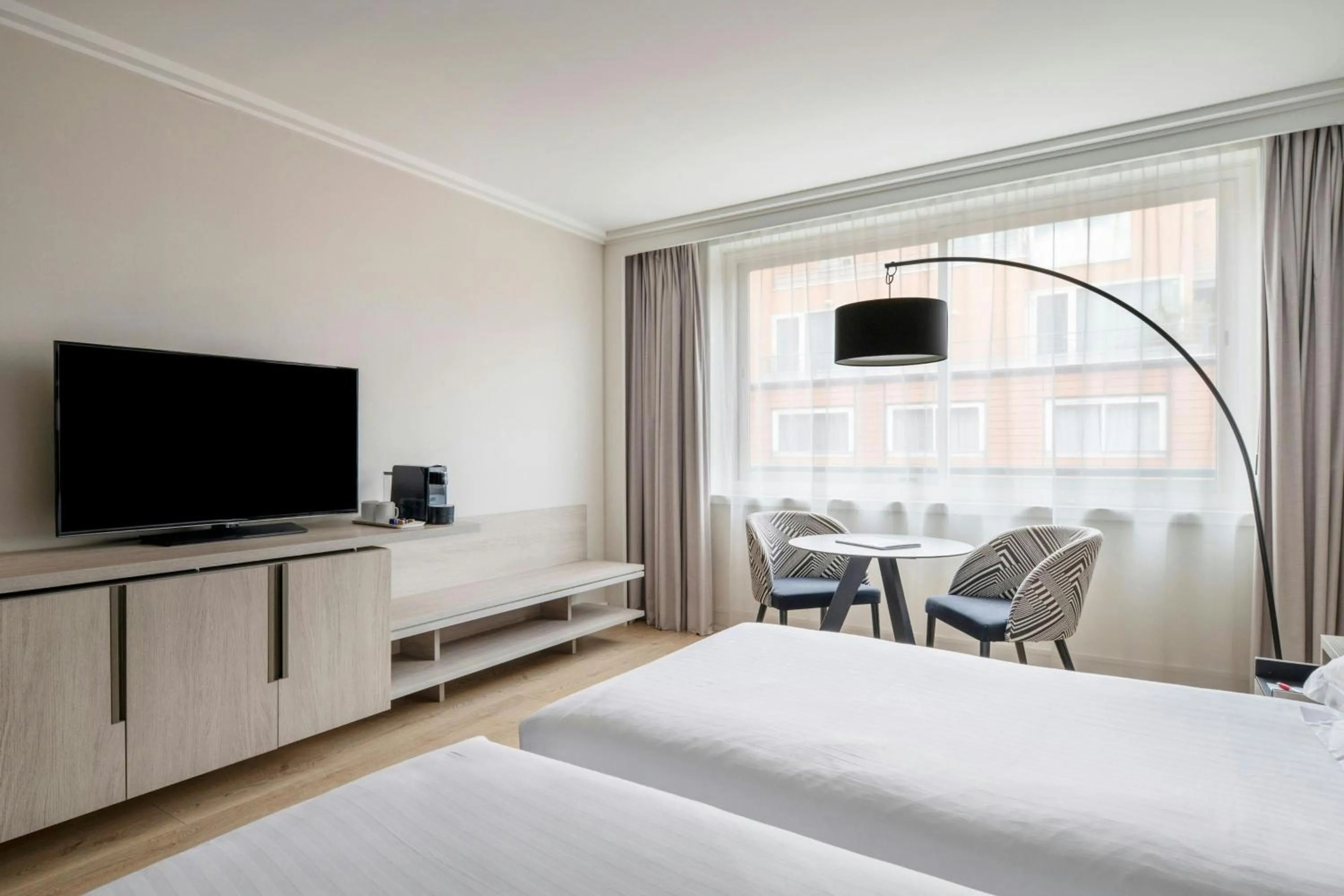 Photo of the whole room, Bed in Lyon Marriott Hotel Cité Internationale
