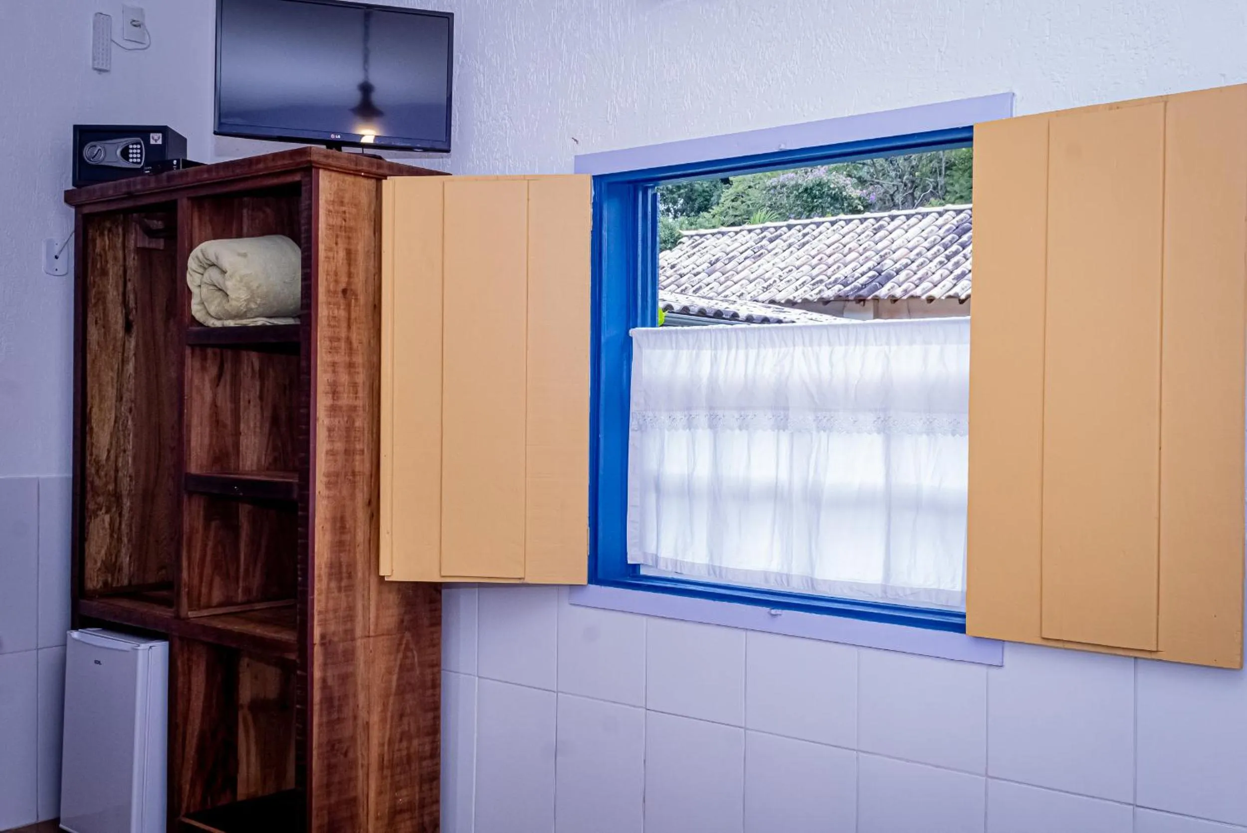 TV and multimedia in Casa de Violeta Pousada