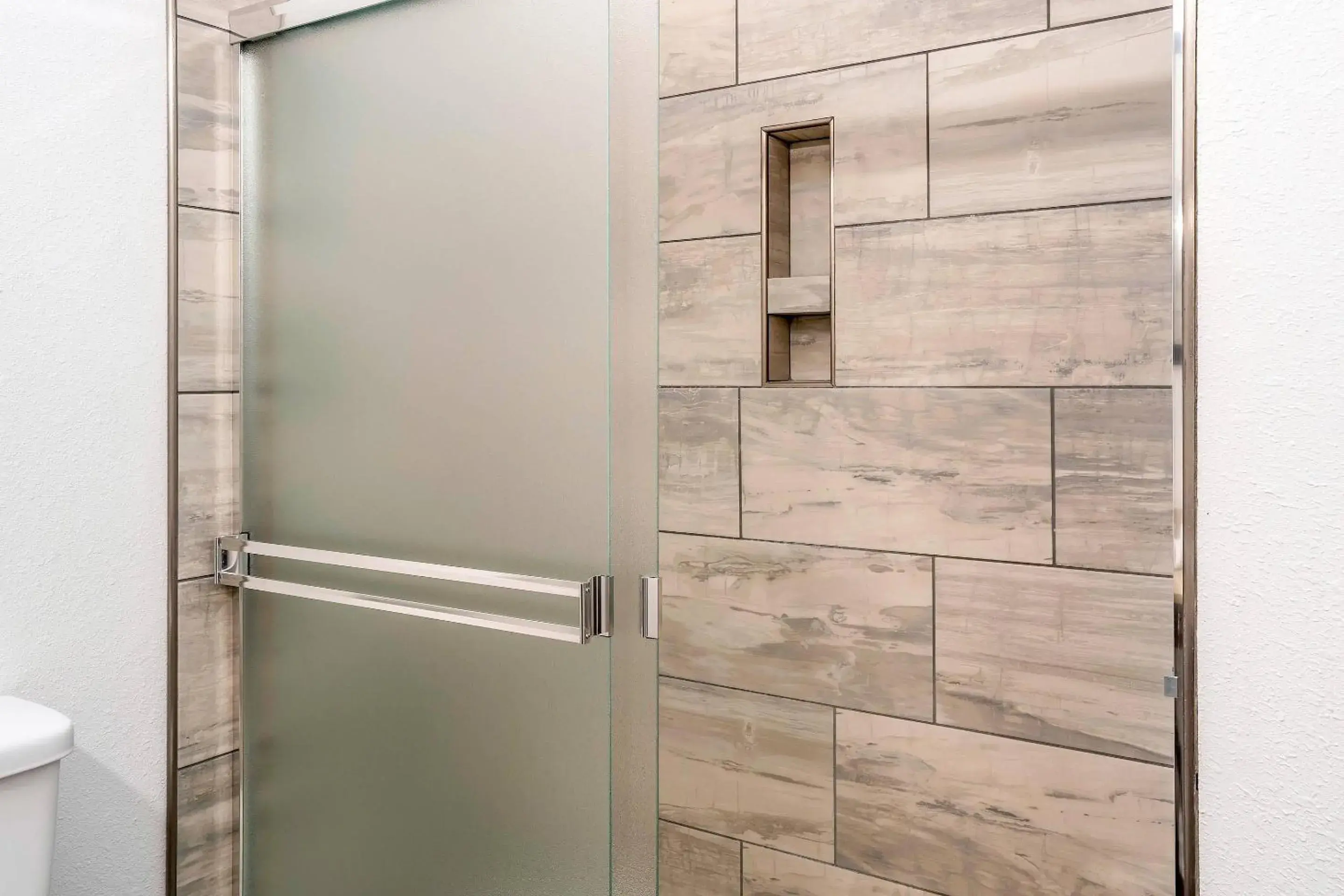 Bedroom in Riverview Inn & Suites, an Ascend Collection Hotel Bedroom in Riverview Inn & Suites, an Ascend Collection Hotel