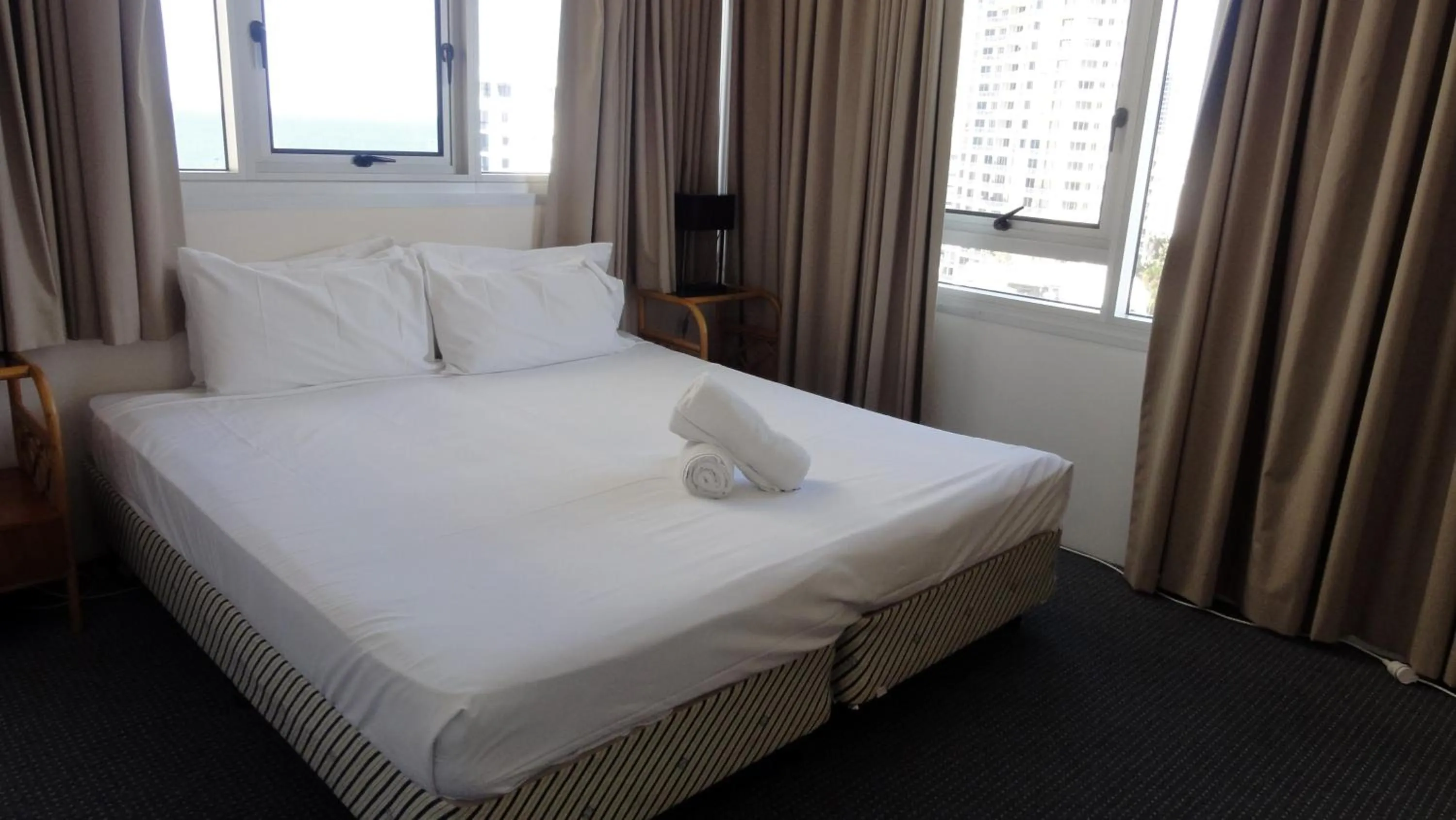 Bed in Quarterdeck Apartments