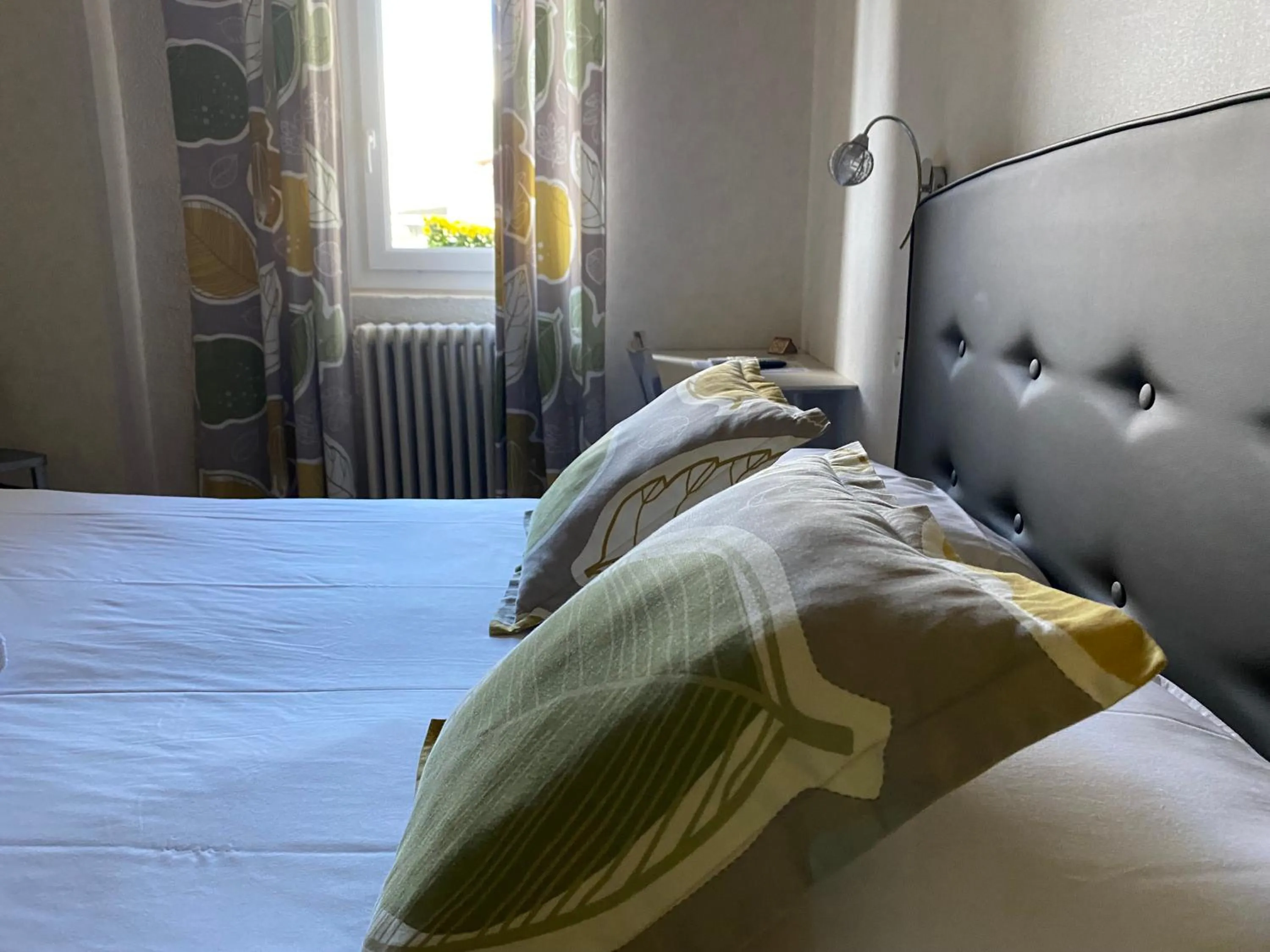 Bed in Logis Hotel Restaurant Le Grand Puech