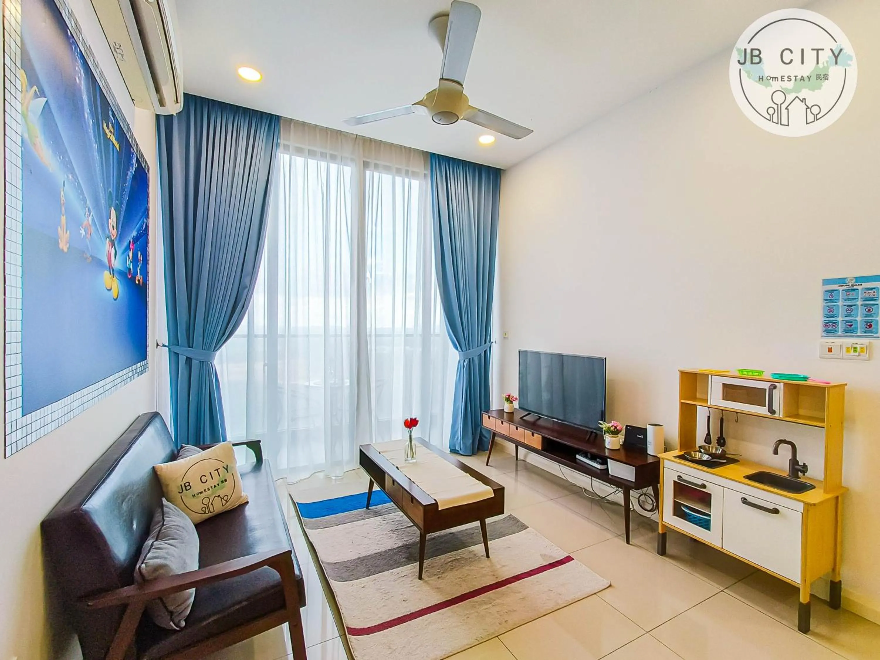 TV and multimedia in D'Pristine Suites by RR JBcity