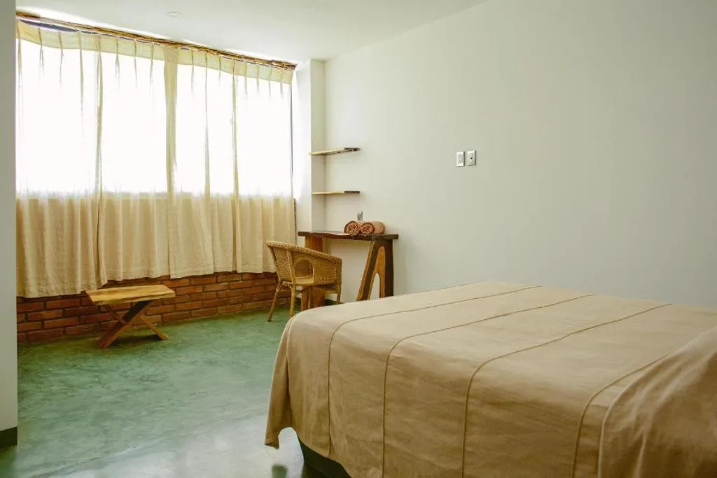 Bed in Madre Tierra Hotel & Coworking