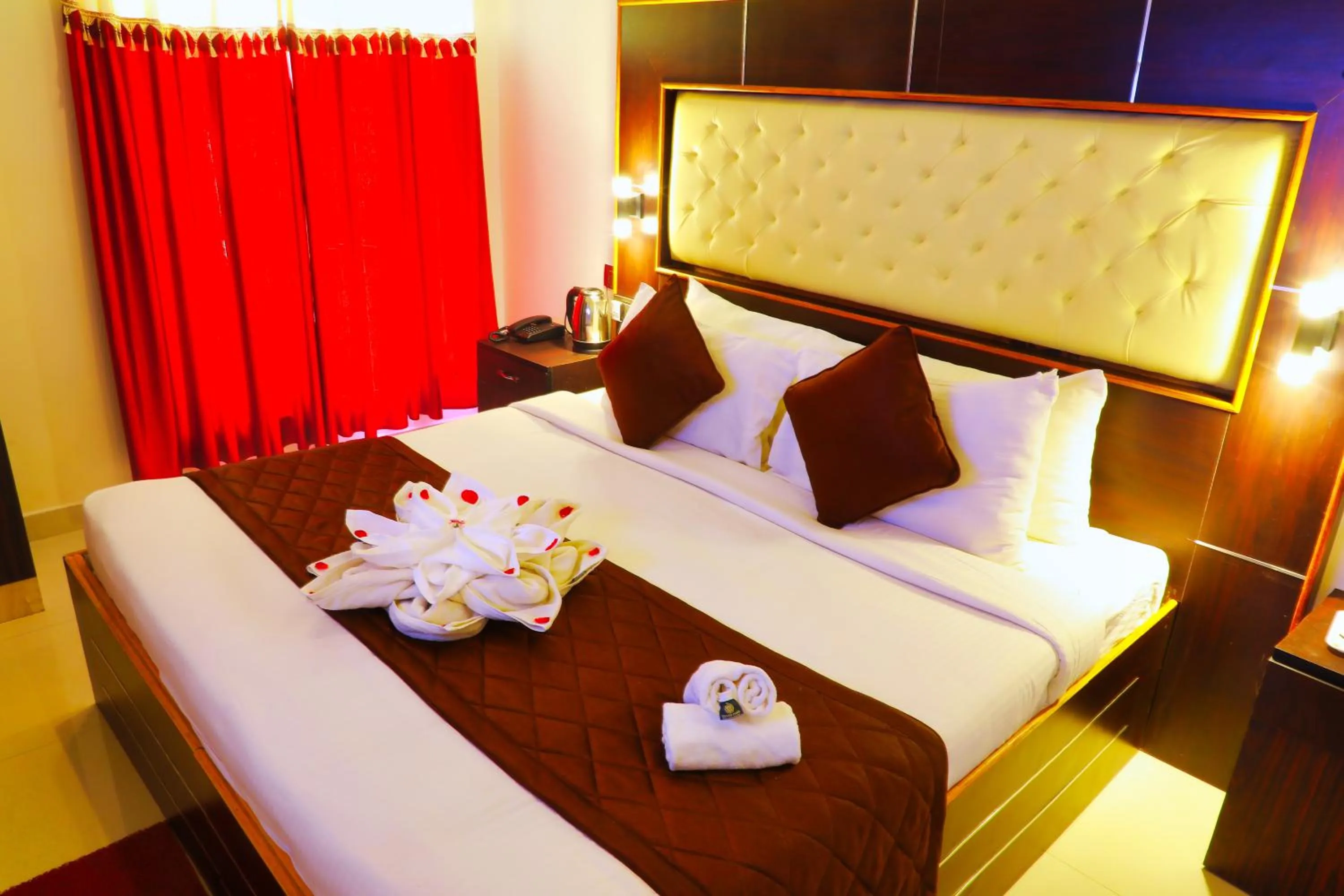 Bed in SS Silver Oaks Resort