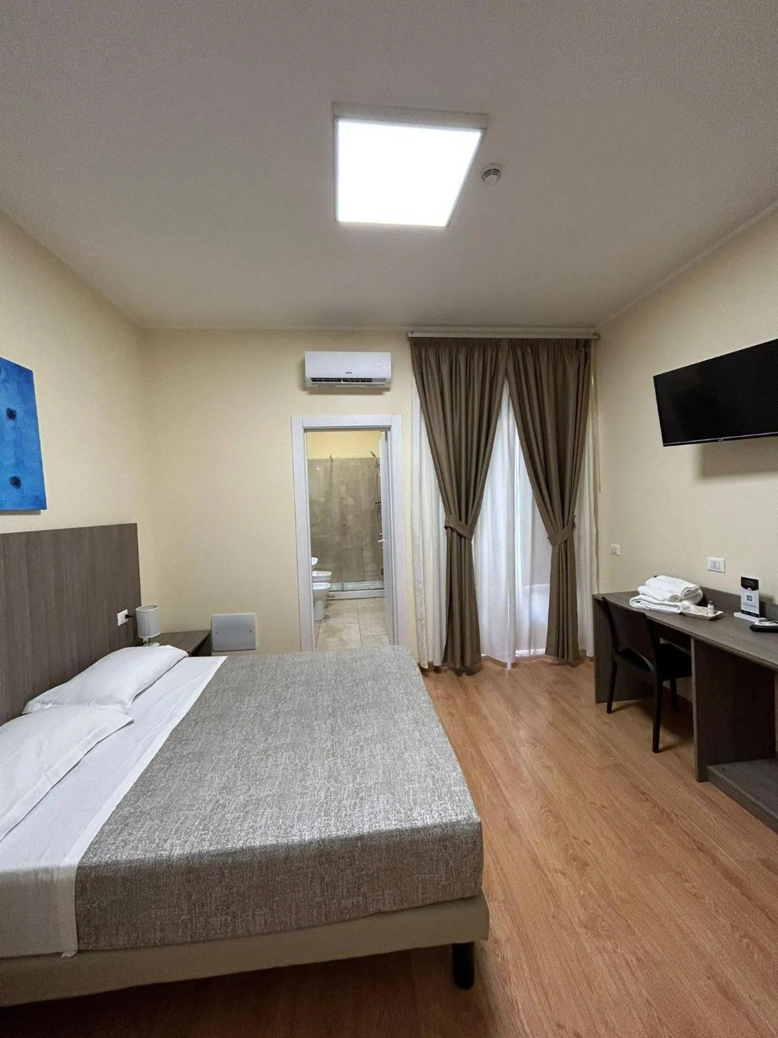 Bed in 55 Aira Hotel