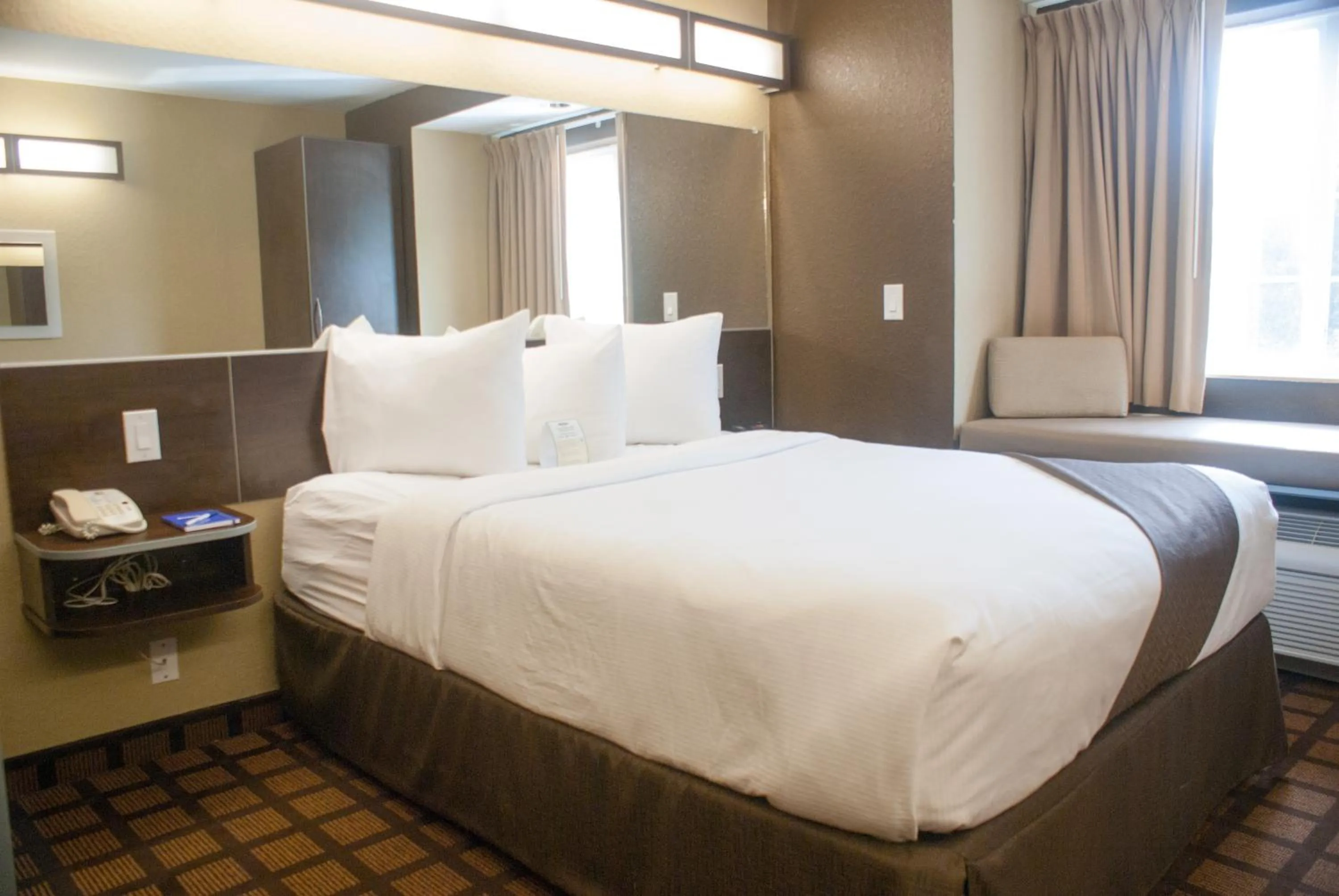 Bed in Microtel Inn & Suites by Wyndham Jacksonville Airport