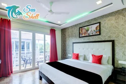 Bedroom, Bed in Sea Shell Beach Cottages & Suites