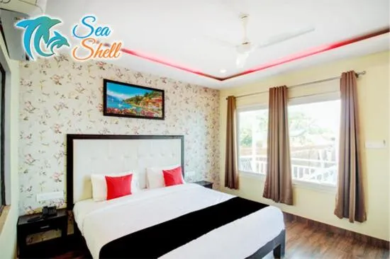 Bed in Sea Shell Beach Cottages & Suites