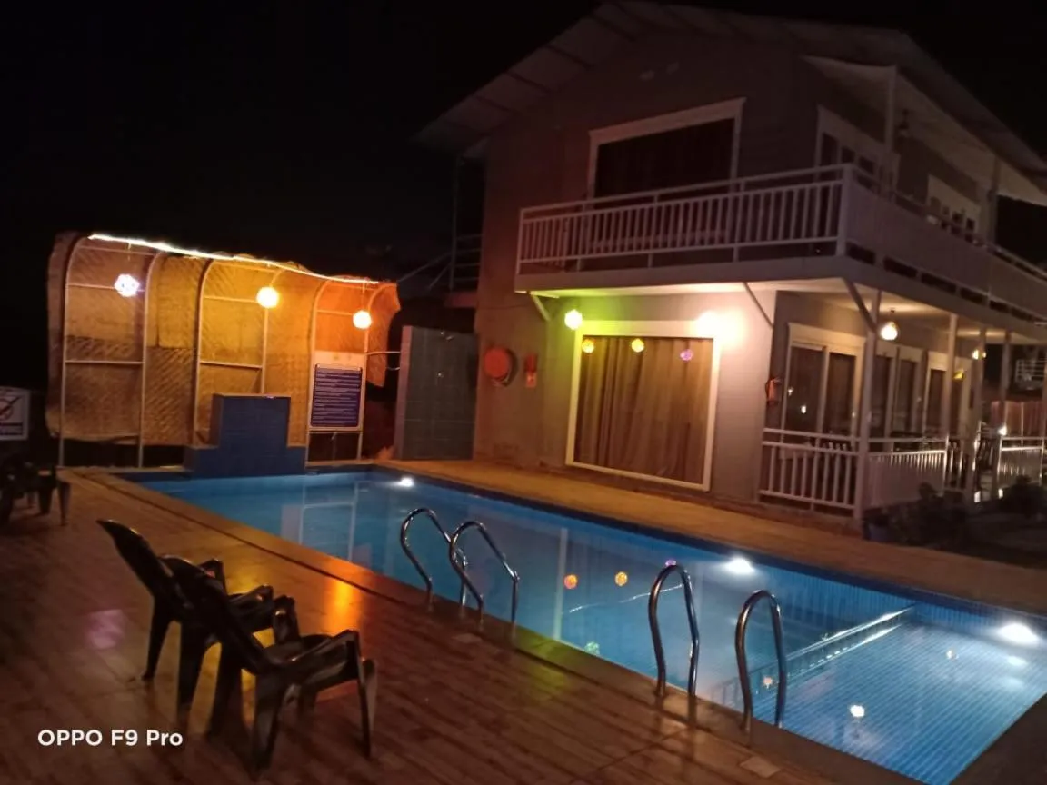 Swimming pool in Sea Shell Beach Cottages & Suites