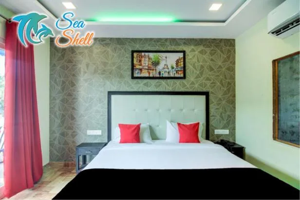 Bed in Sea Shell Beach Cottages & Suites