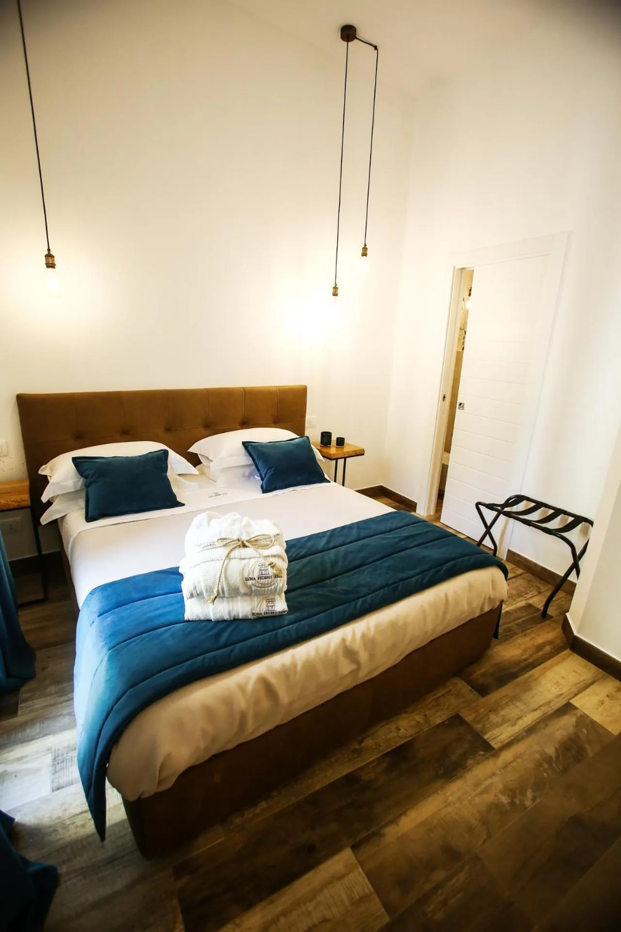 Bed in Luna Federiciana Luxury Room & Spa