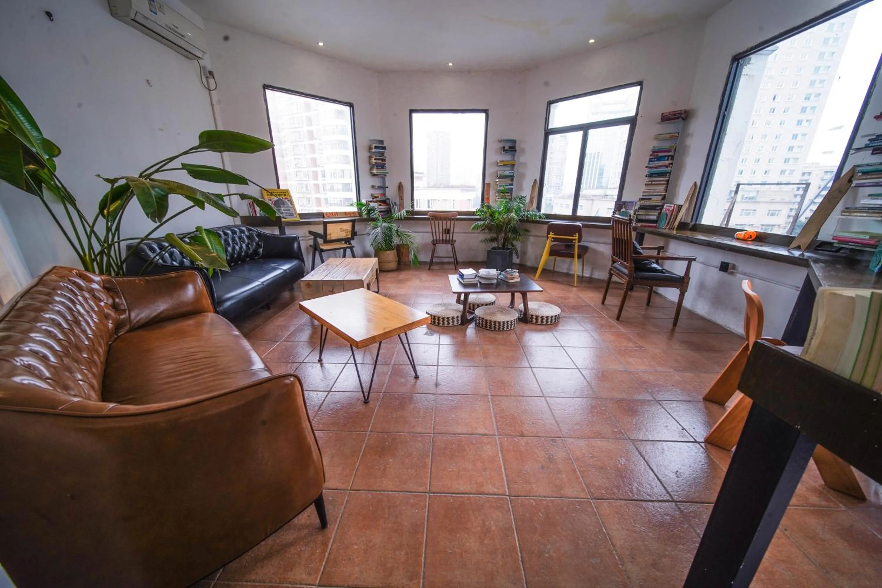 Seating area in Chengdu Local Tea Hostel - Short Walk To Taikooli - Chill & Social Coffee Lounge - Metro downstairs - Free Activities - Friendly English Speaking Staff - Tibet, Panda, Buddha & Snow Mountain Tours