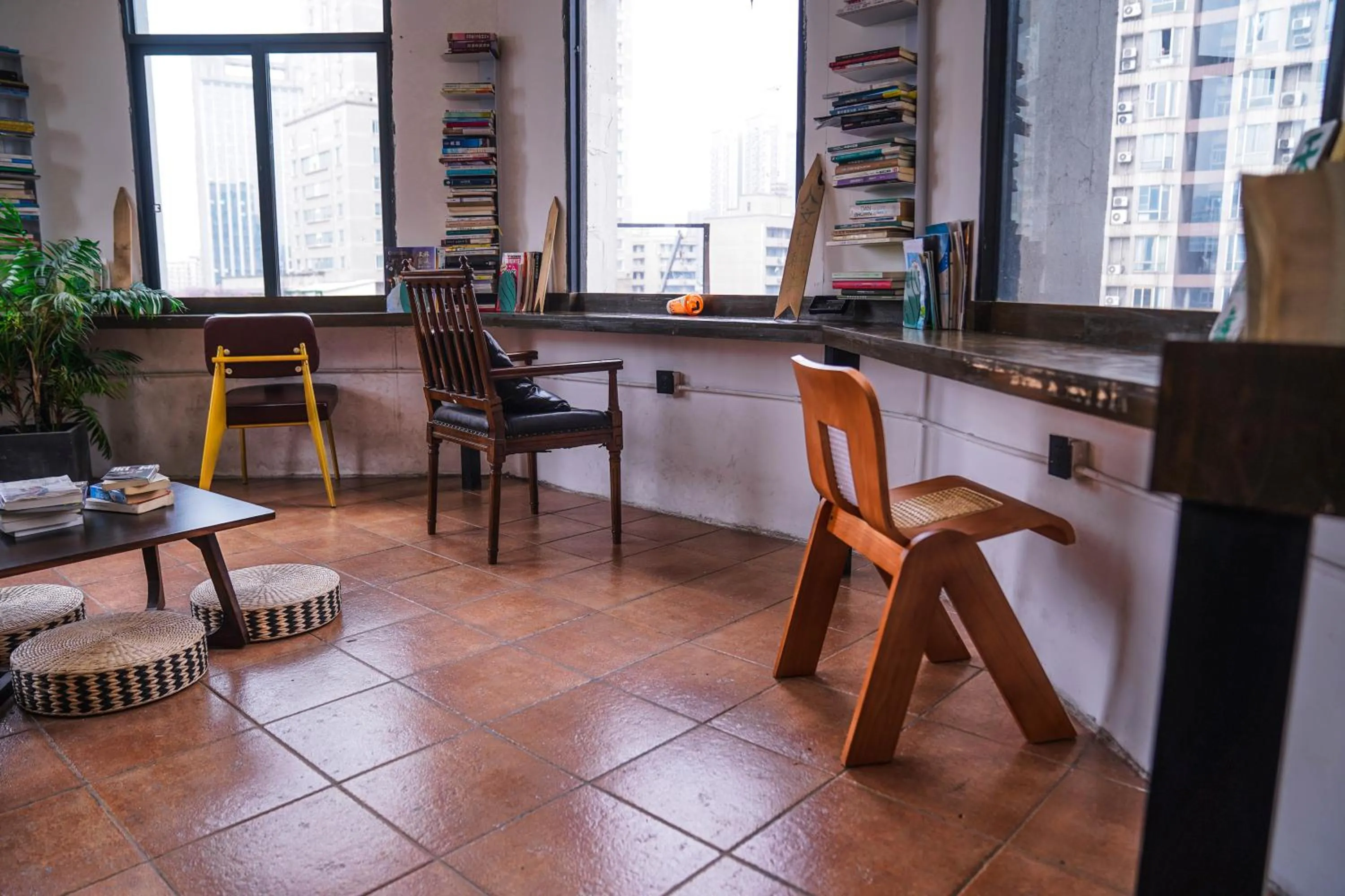 Seating area in Chengdu Local Tea Hostel - Short Walk To Taikooli - Chill & Social Coffee Lounge - Metro downstairs - Free Activities - Friendly English Speaking Staff - Tibet, Panda, Buddha & Snow Mountain Tours