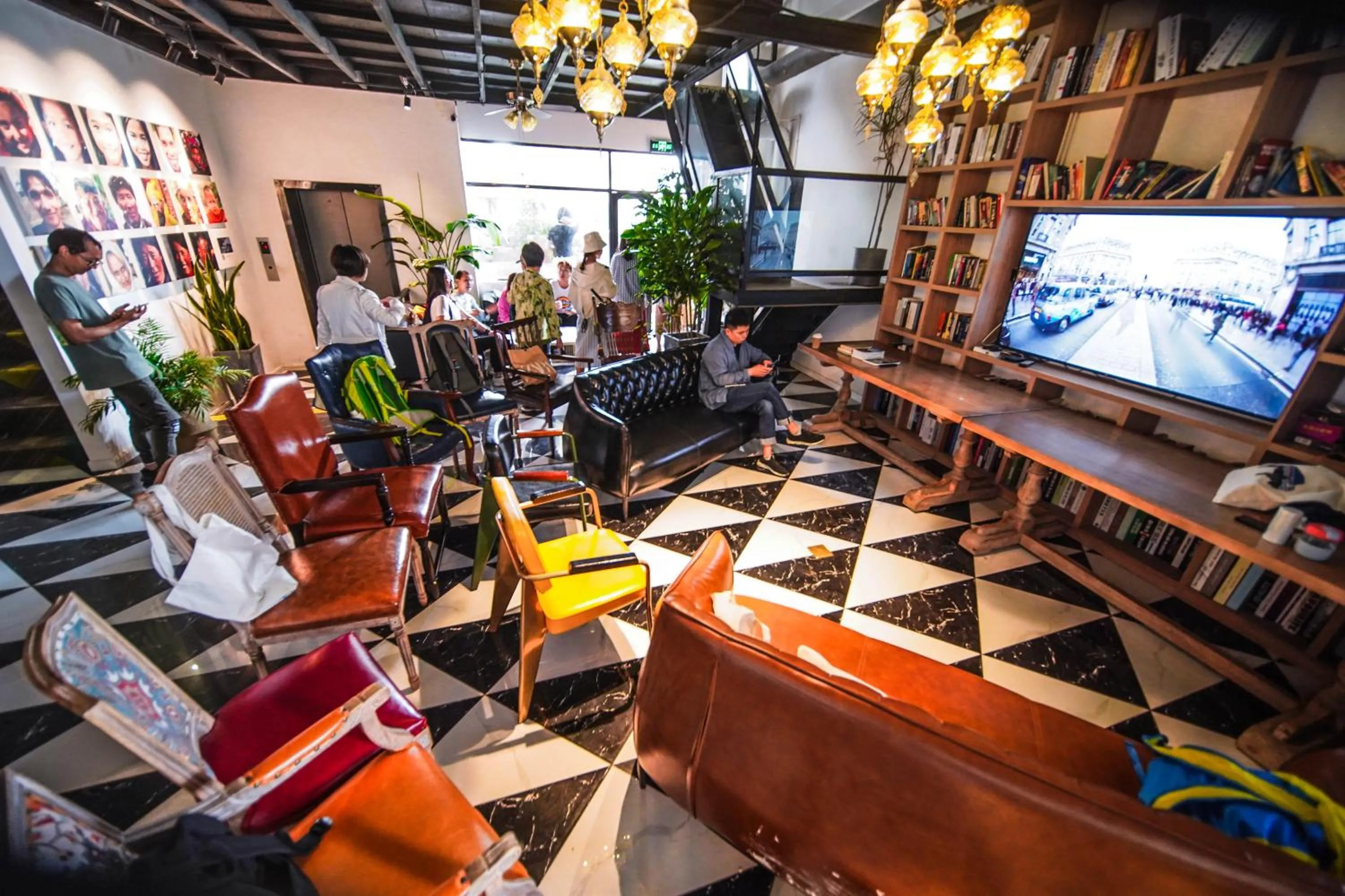 Communal lounge/ TV room in Chengdu Local Tea Hostel - Short Walk To Taikooli - Chill & Social Coffee Lounge - Metro downstairs - Free Activities - Friendly English Speaking Staff - Tibet, Panda, Buddha & Snow Mountain Tours