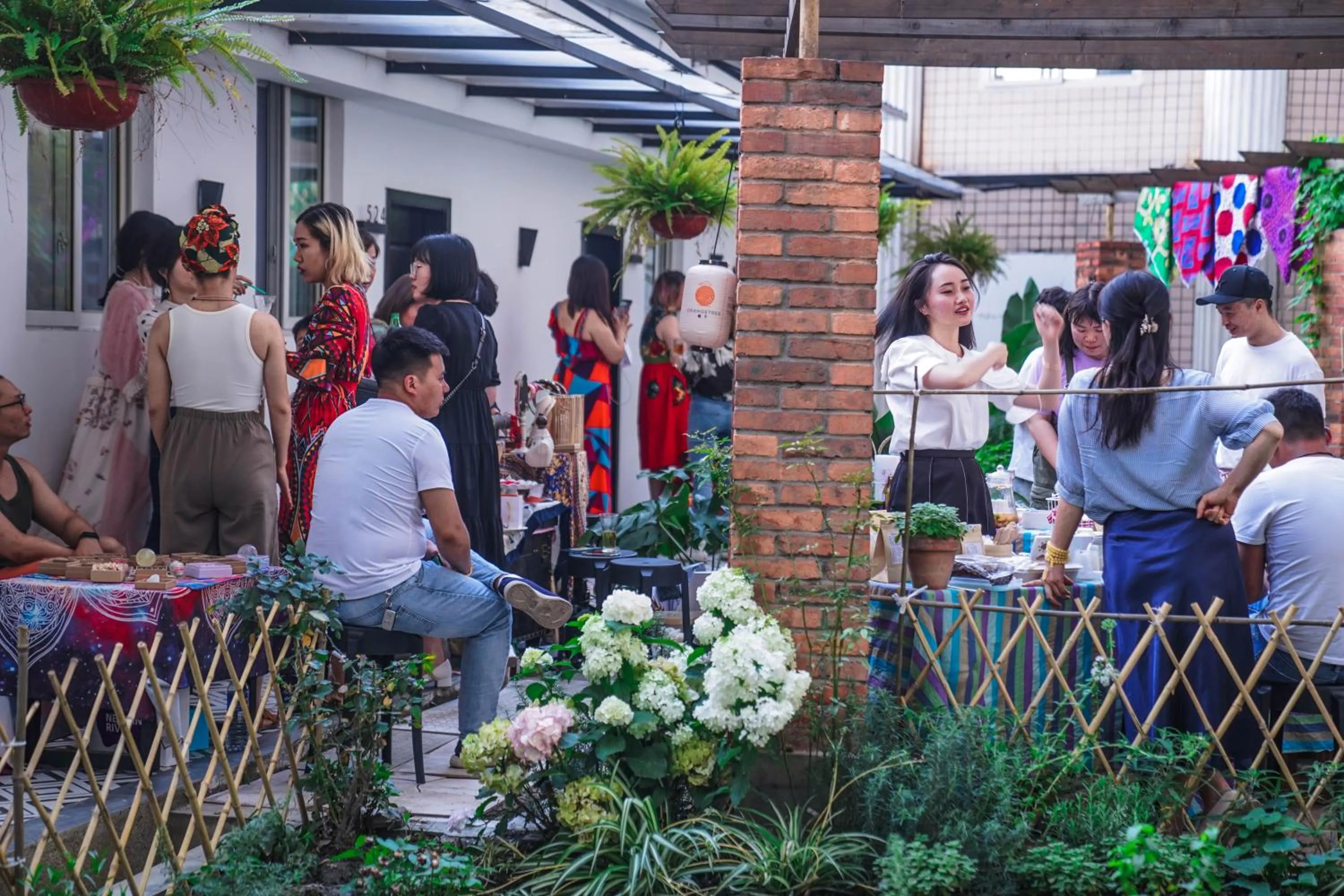 group of guests in Chengdu Local Tea Hostel - Short Walk To Taikooli - Chill & Social Coffee Lounge - Metro downstairs - Free Activities - Friendly English Speaking Staff - Tibet, Panda, Buddha & Snow Mountain Tours