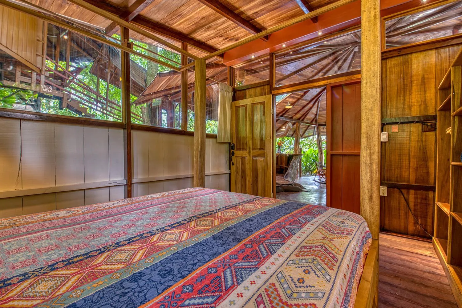 Bed in Tree House Beachfront Lodge