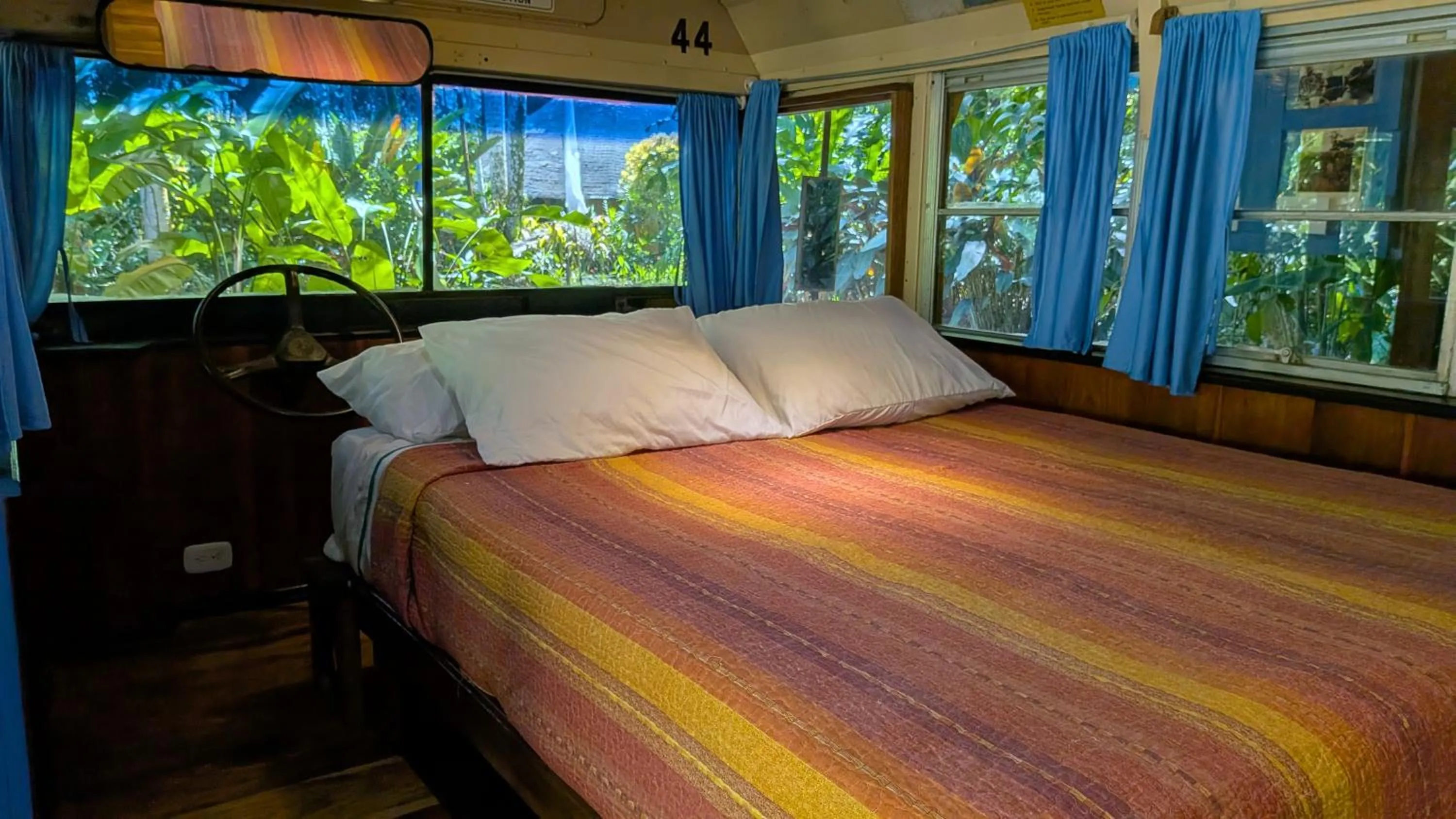 Bed in Tree House Beachfront Lodge