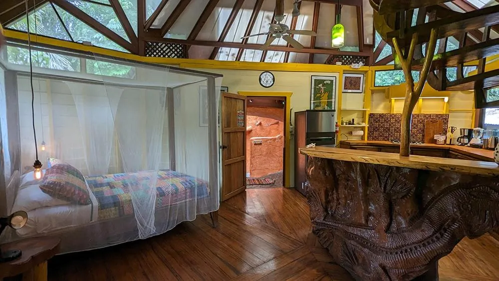 Bed in Tree House Beachfront Lodge