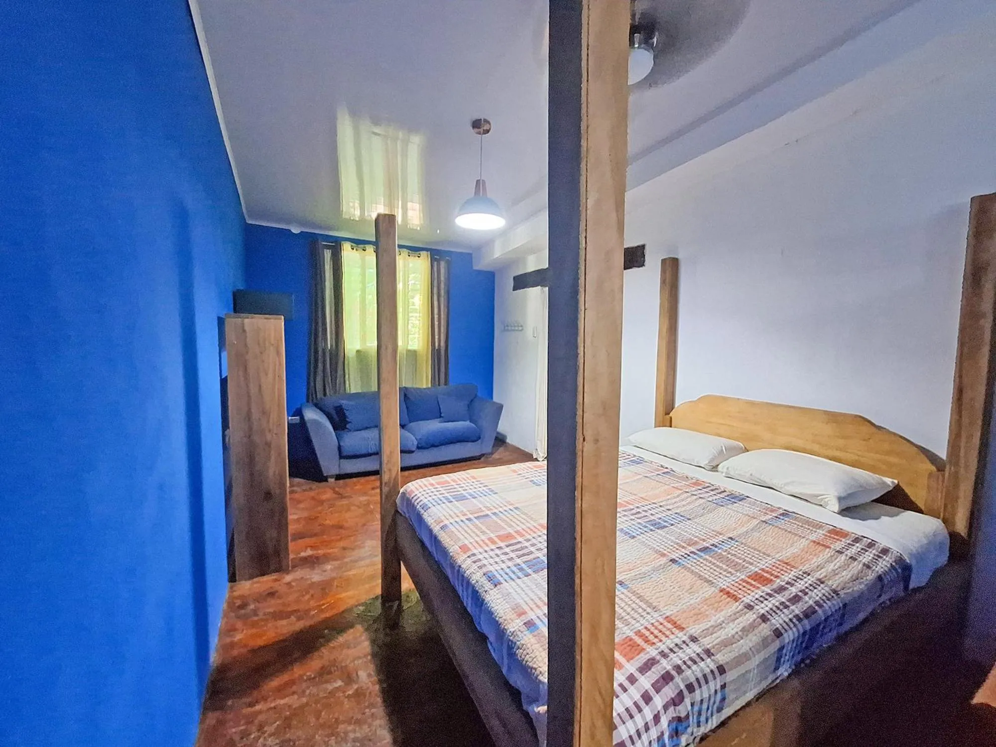 Bed in Tree House Beachfront Lodge