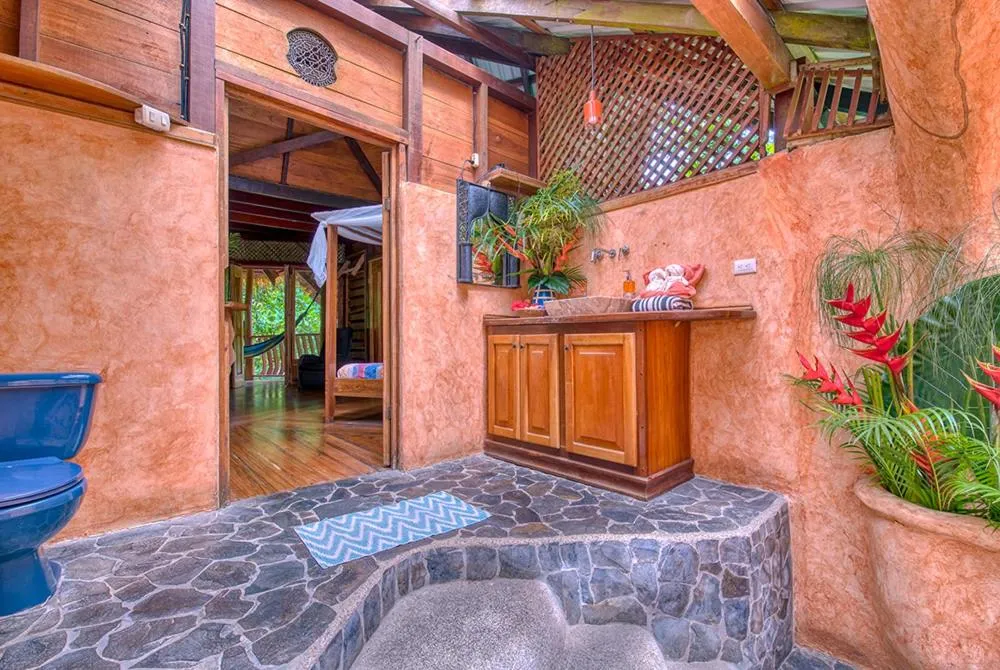 Bathroom in Tree House Beachfront Lodge