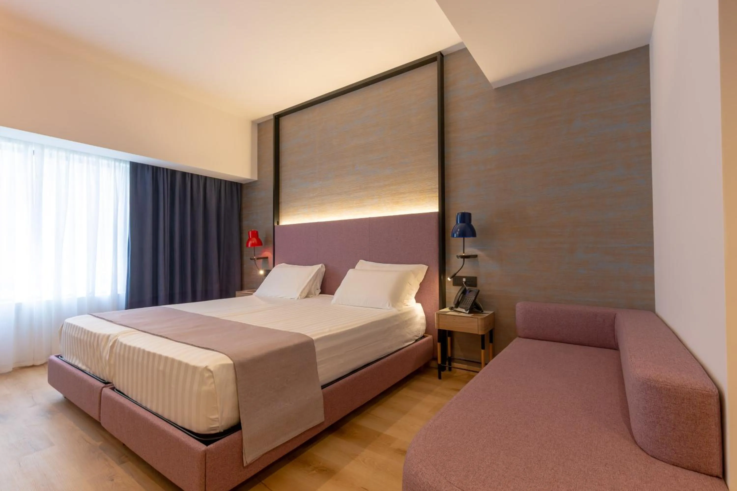 Bed in Hotel Poseidon