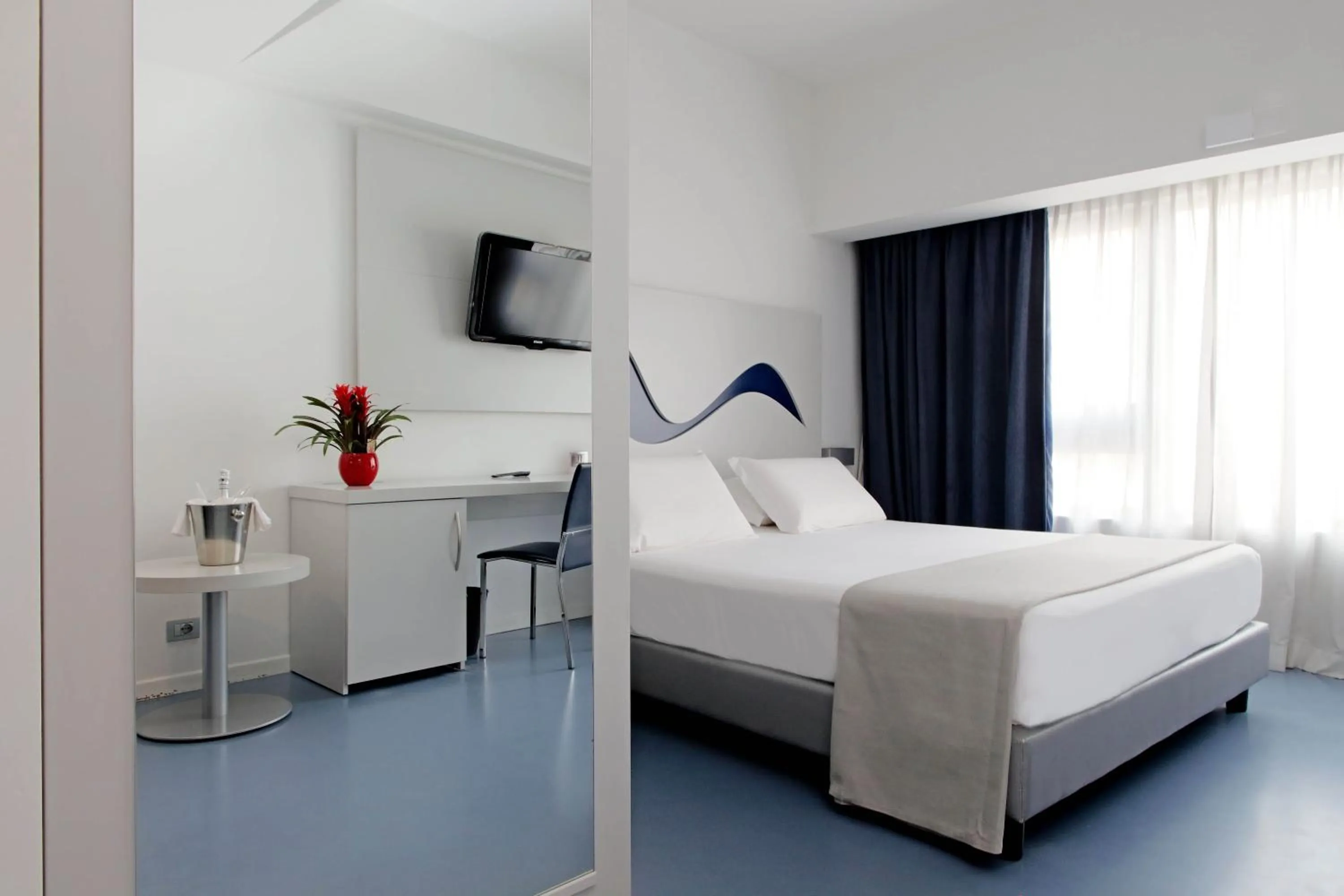 Bed in Hotel Poseidon