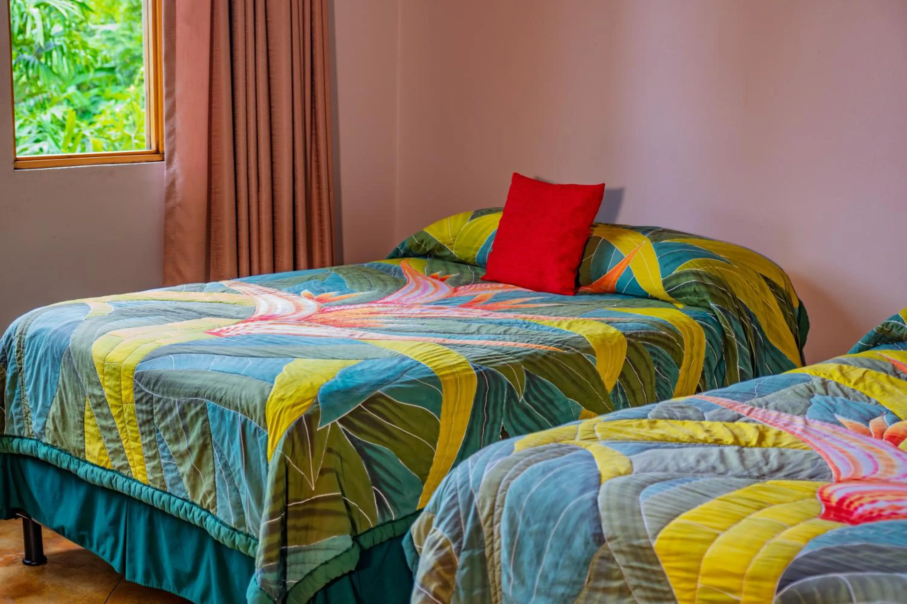 Bed in Lost Iguana Resort and Spa