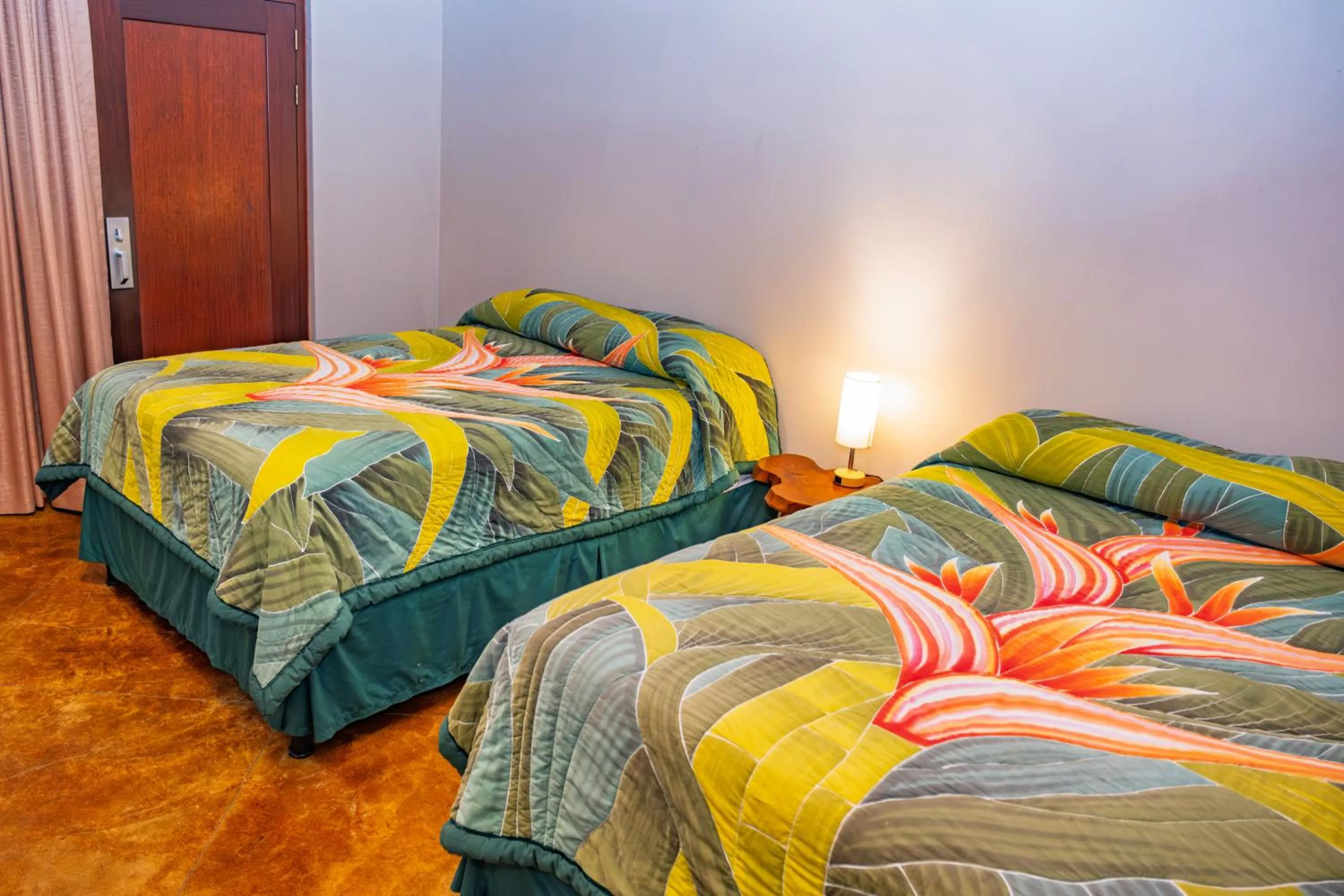 Bed in Lost Iguana Resort and Spa